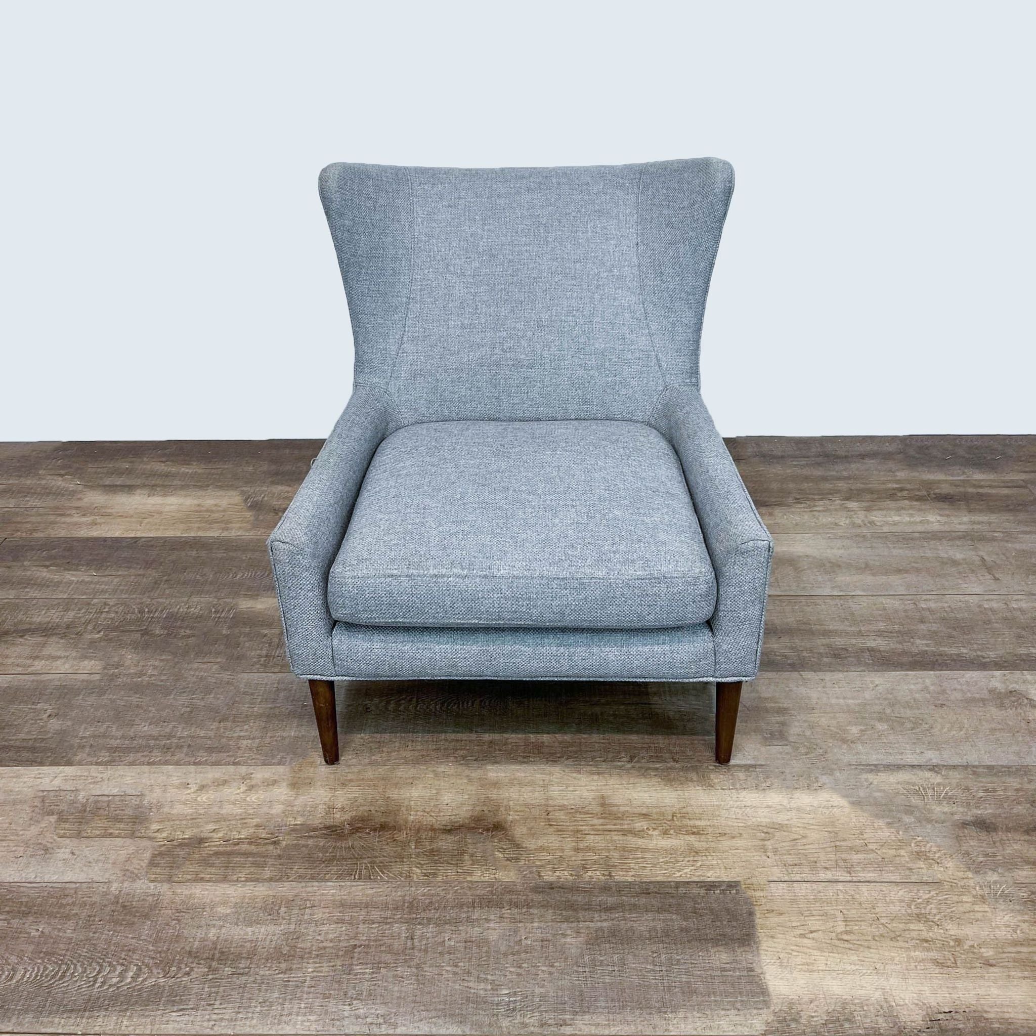 Modern Marlow chair by Four Hands, front view, showcasing sleek lines with gray fabric and tapered wooden legs.