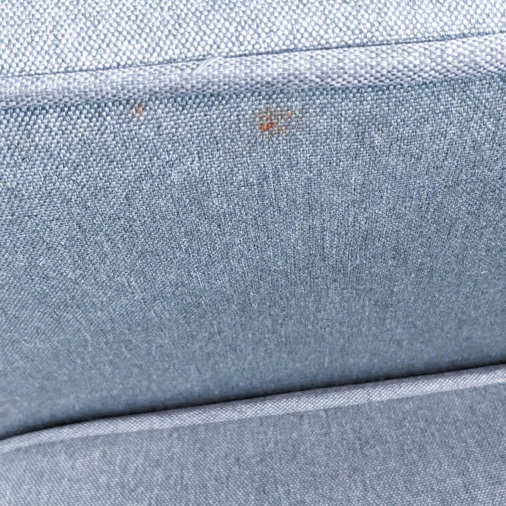 Close-up of Zinus sofa fabric texture with button back cushions, highlighting piped detailing and material quality.
