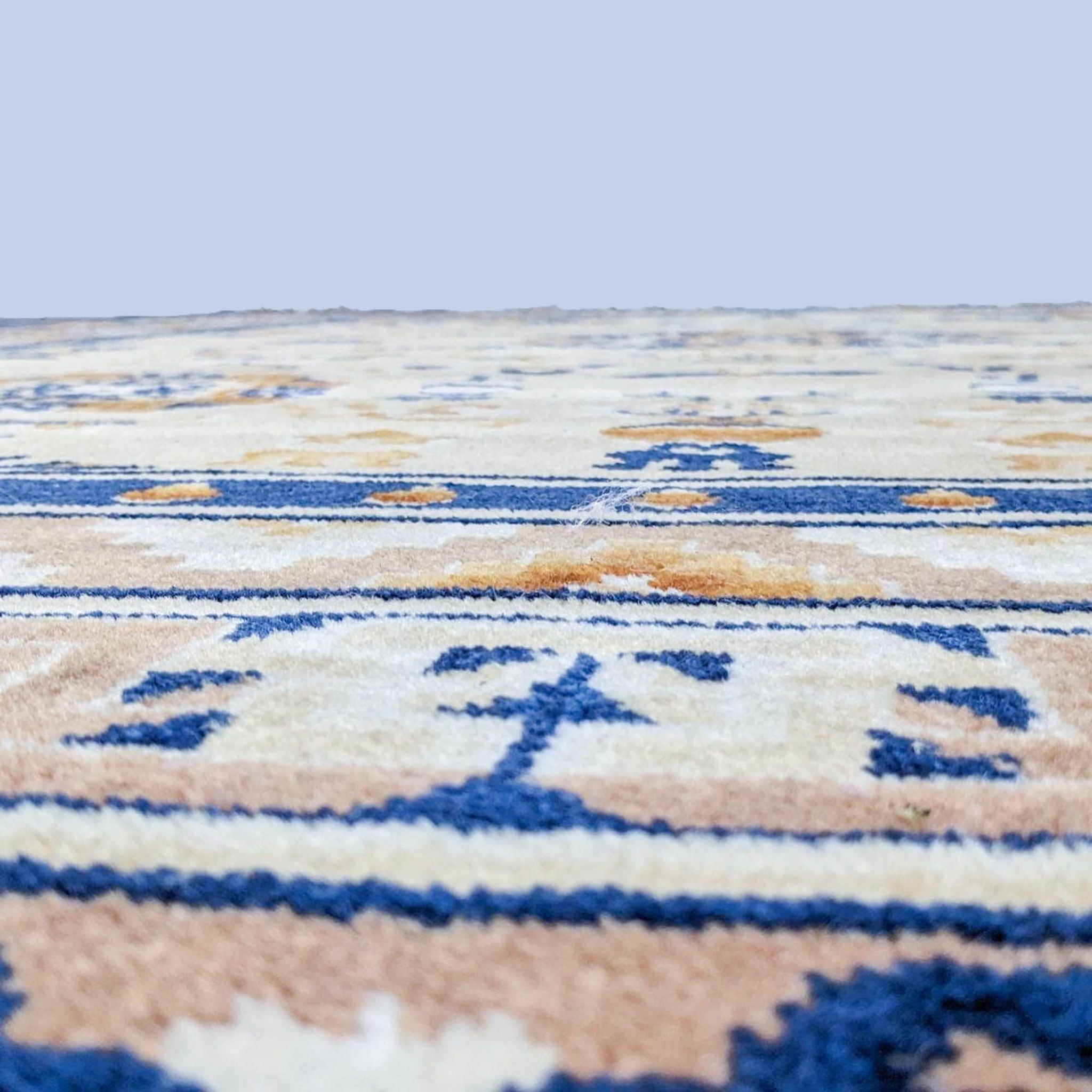2. Close-up view of a 100% wool Karastan Chinese Cathay Medallion rug's texture, highlighting its intricate blue and gold designs.