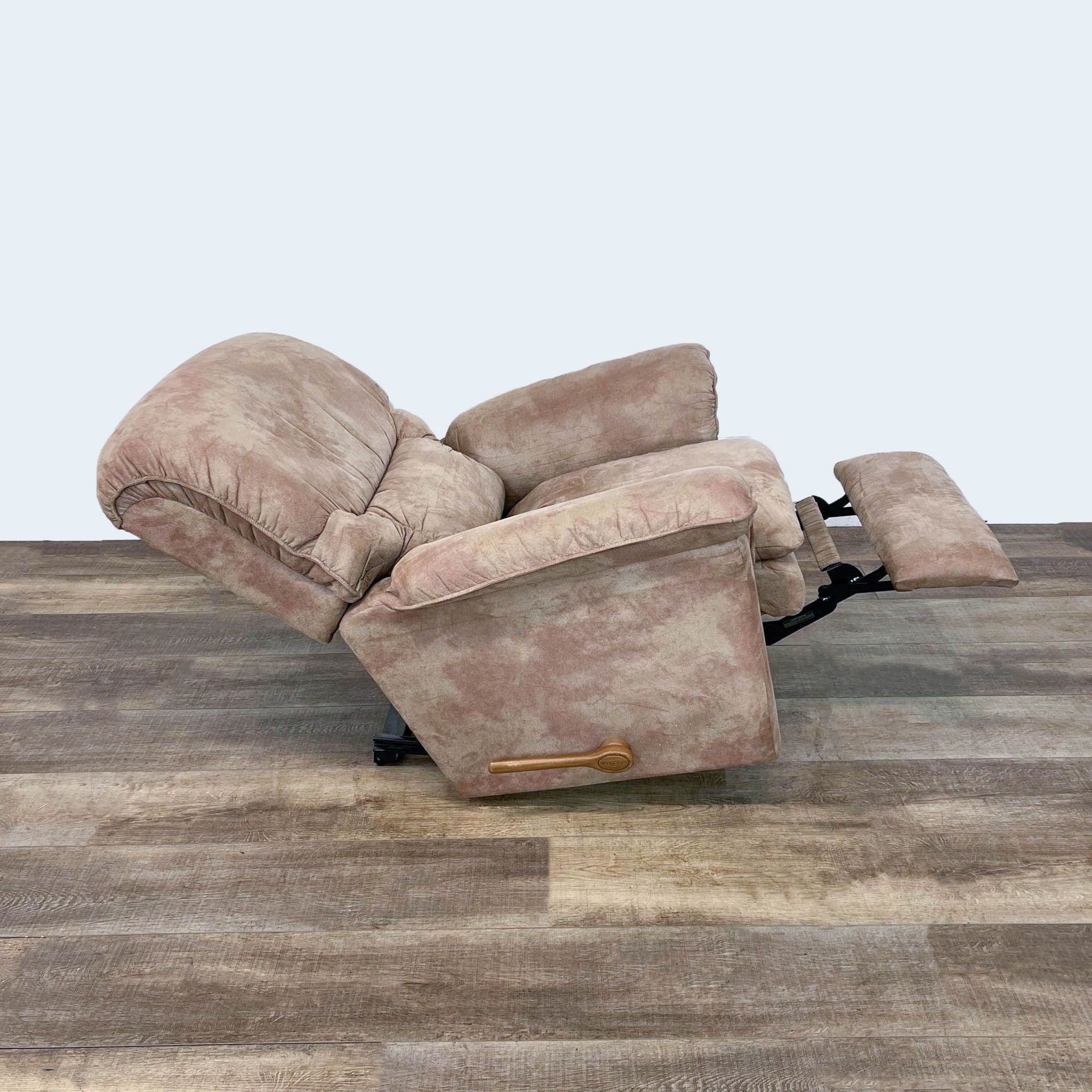 La-Z-Boy Trevor recliner shown in manual recline position, with plush upholstery and wooden handle visible on the side.