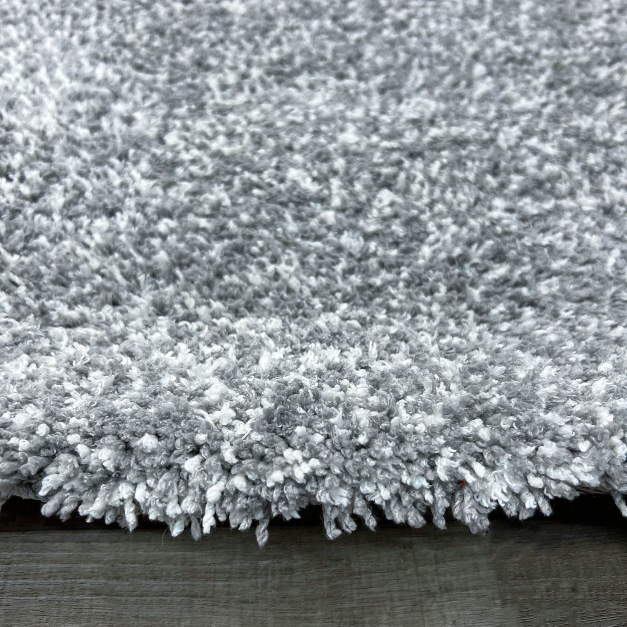 2. Close-up of the Bliss rug by KAS, emphasizing the dense, soft polyester weave and its stain-resistant feature for lasting beauty in a home setting.
