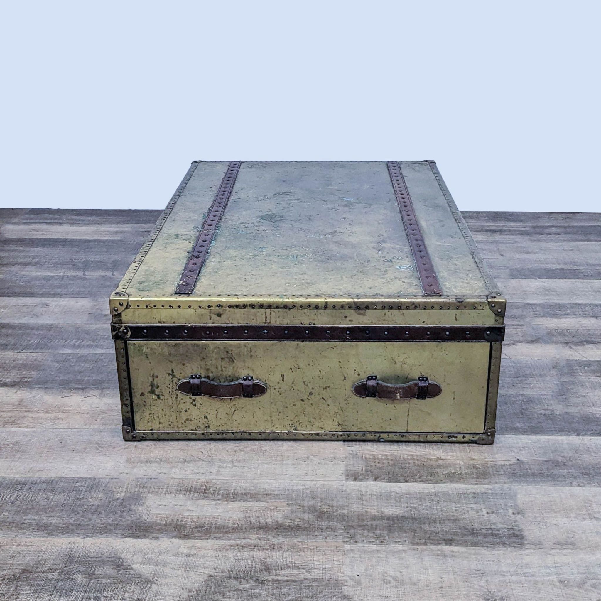 Reperch vintage coffee table with distressed finish and leather handles on the drawers, showcased from the top angle.