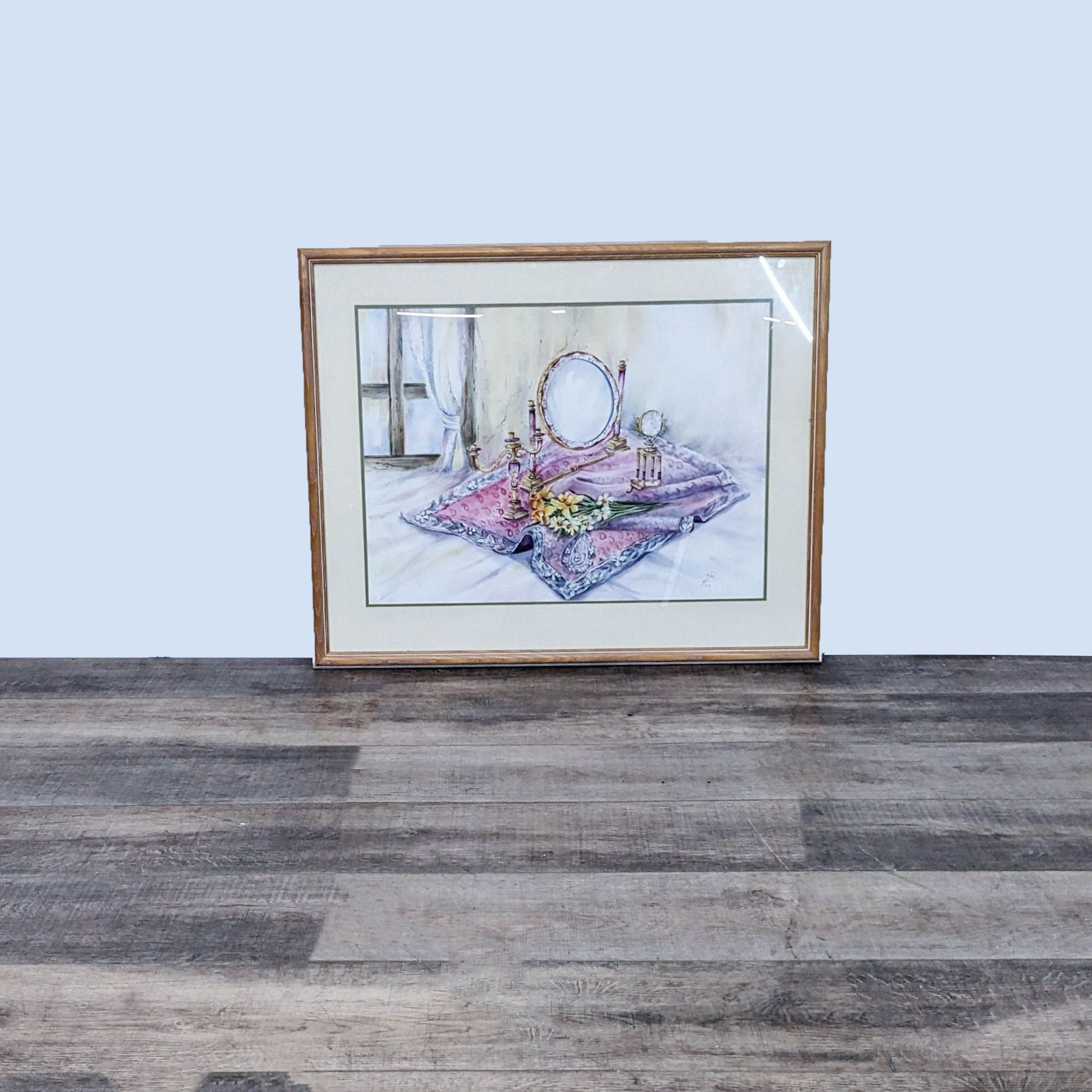 Alt text: Framed painting by Reperch depicting a vanity with a mirror, flowers, a clock, and a candleholder, dated 2017.