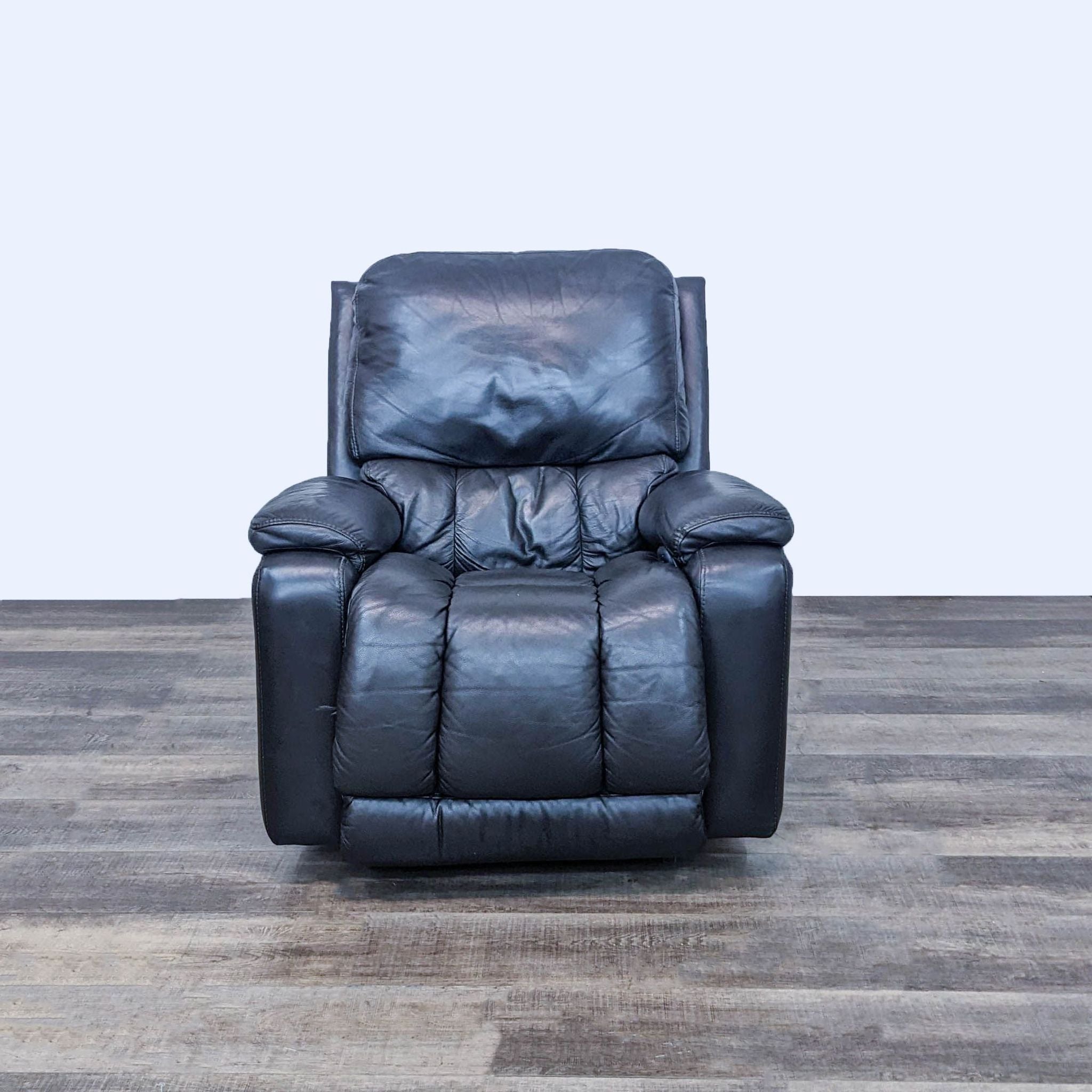 La-Z-Boy Greyson power recliner in Grey Stone, showcasing contemporary curves and bucket chaise seat, with hardwood floor background.