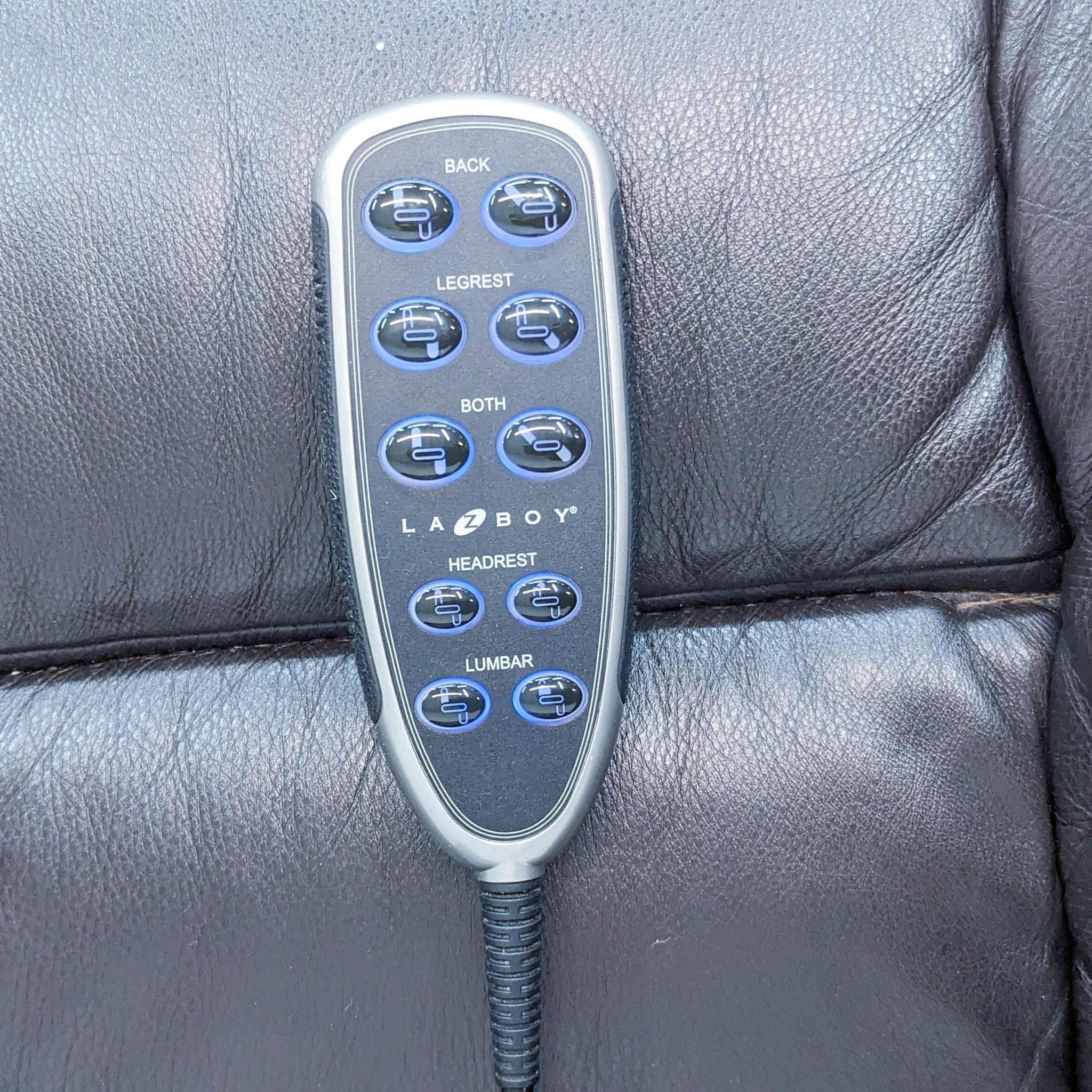 Handheld power control with buttons for back, leg rest, headrest, and lumbar on a La-Z-Boy Greyson power recliner.