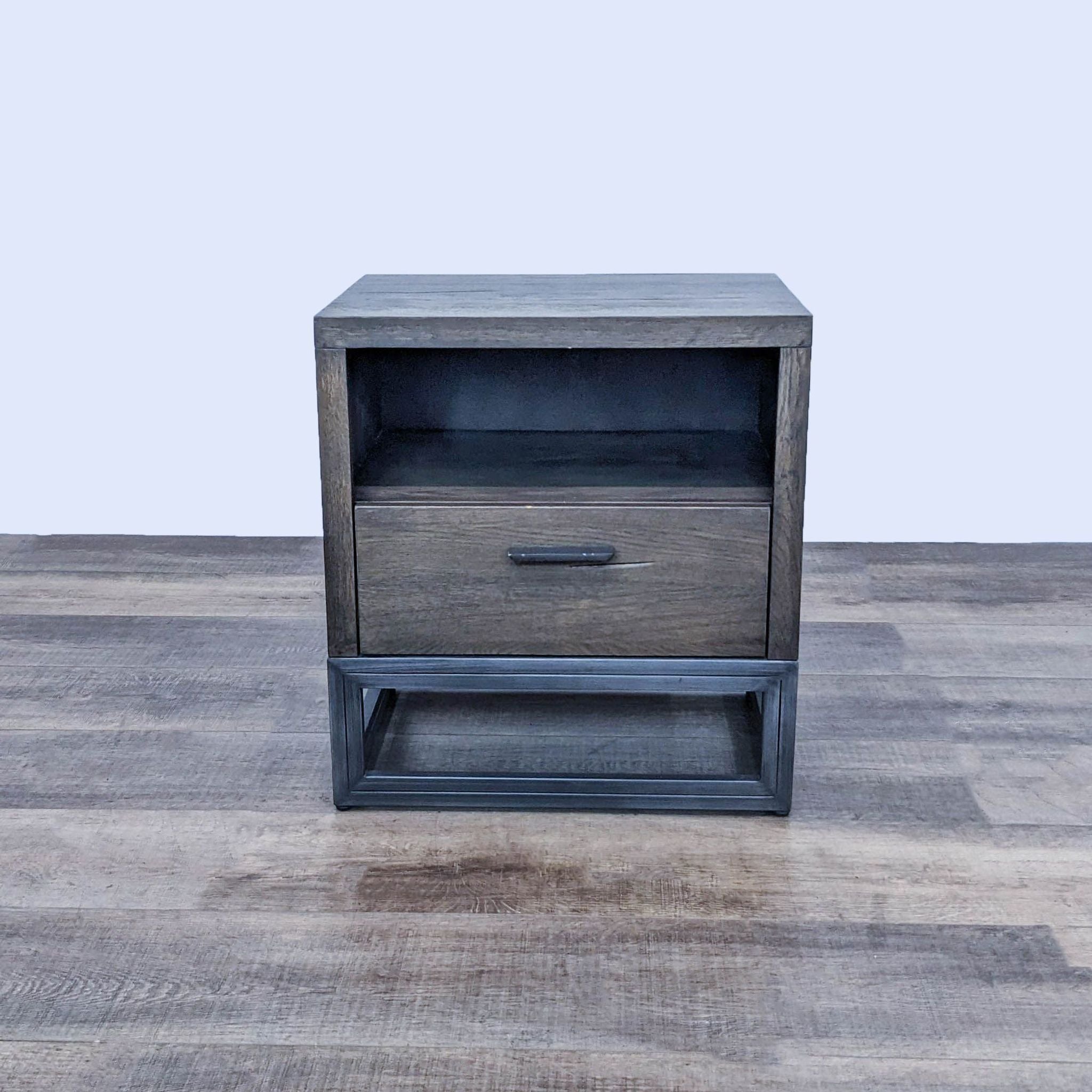 Reperch end table with a metal base, showing an open shelf above a closed drawer, in a wooden finish.