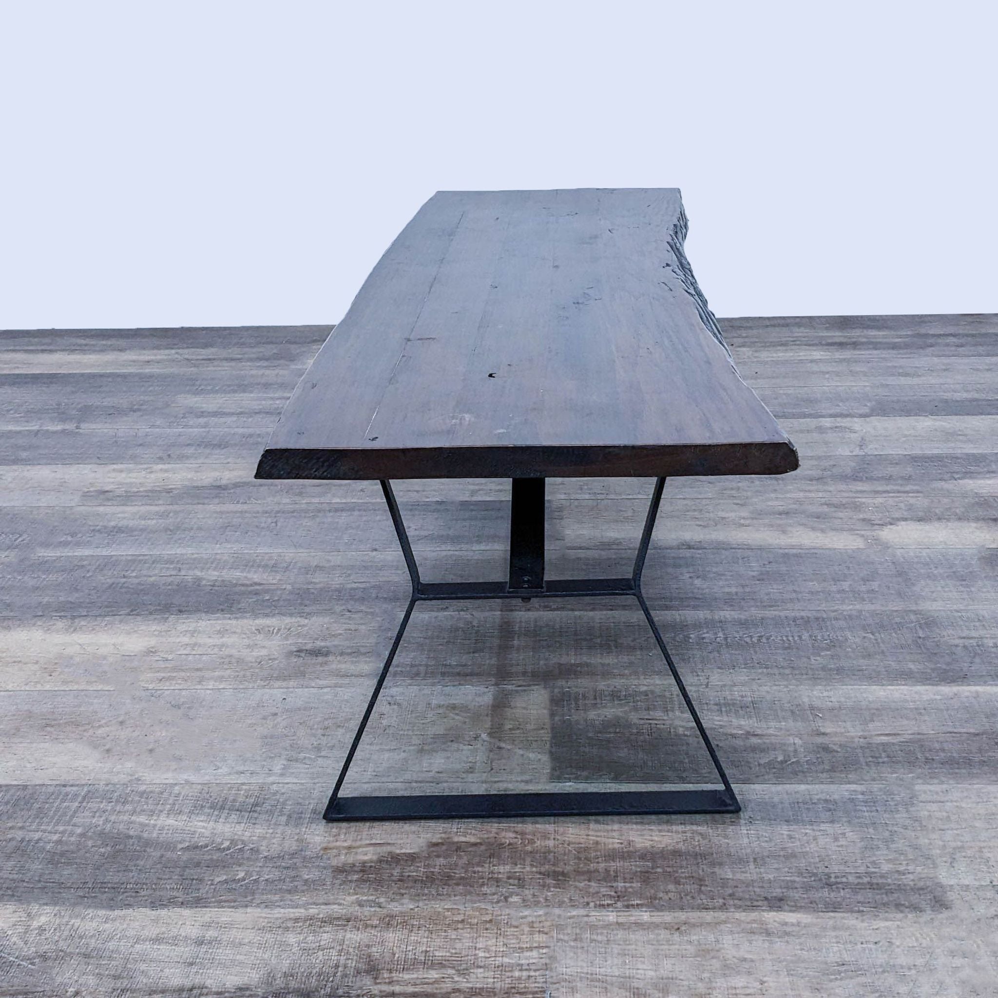 Reperch brand coffee table with a rectangular dark wood top and a metal base on a wooden floor.