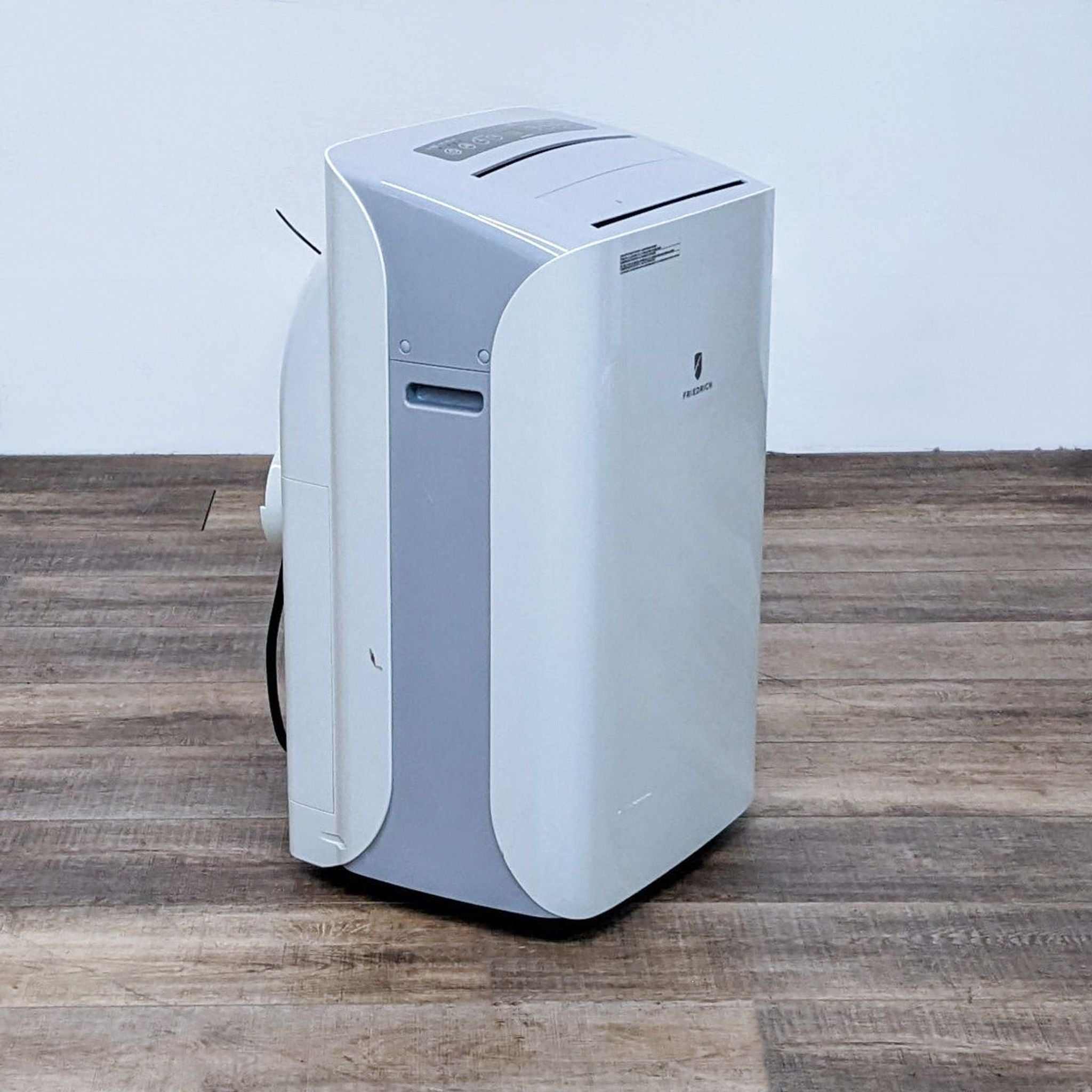 Alt text 2: Side angle of a white Friedrich portable AC unit showing its profile and vent.