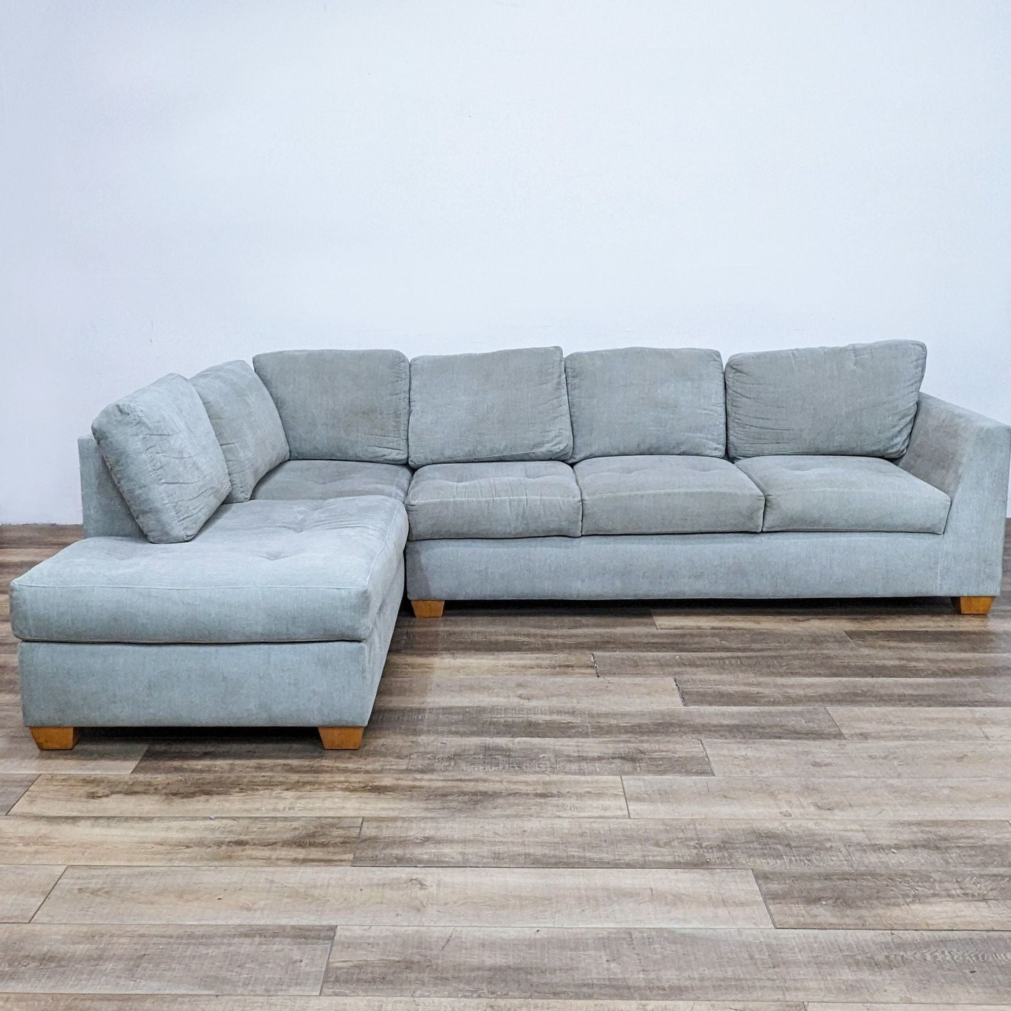 a pair of italian blue suede sectionals