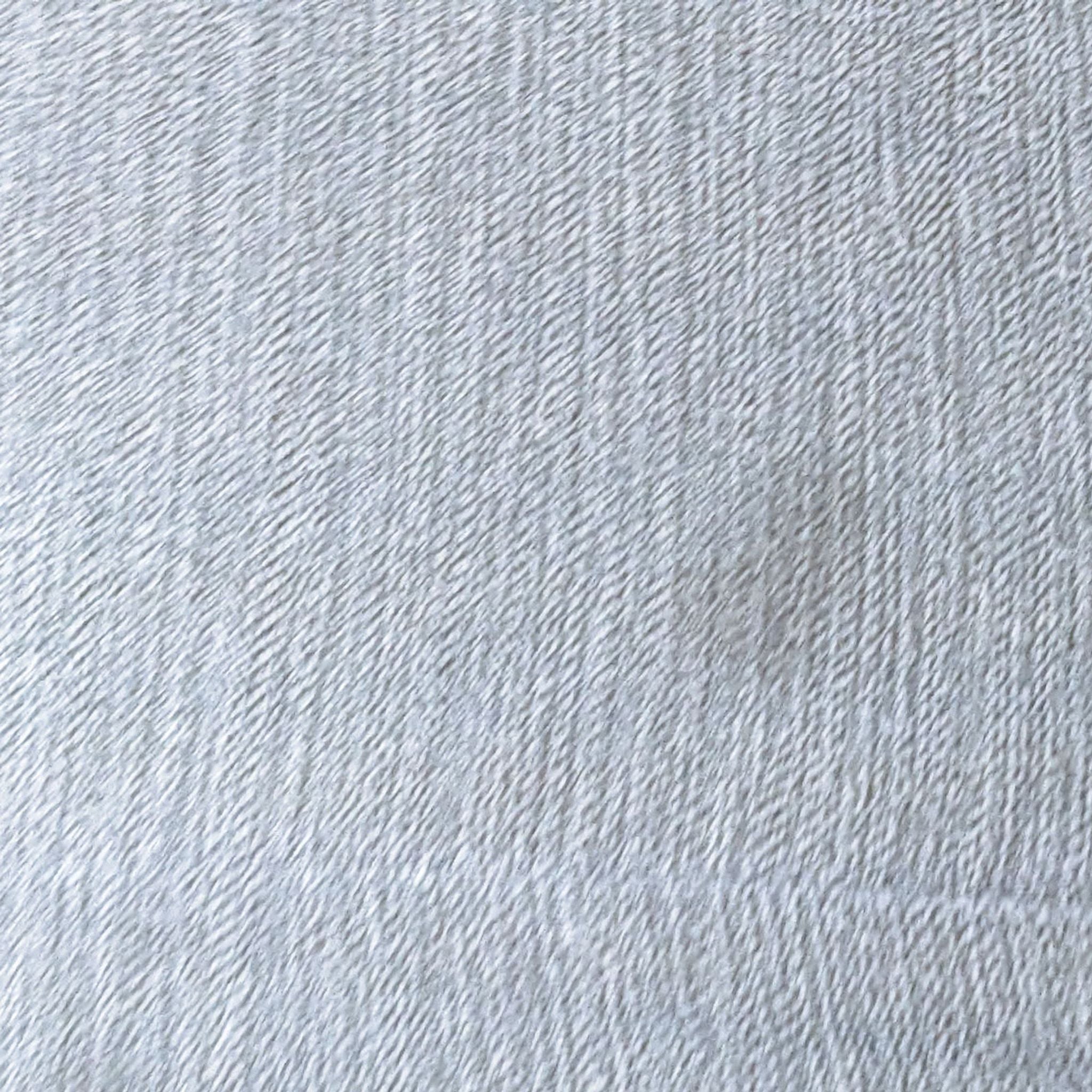 a close up of a silver fabric with a pattern of white thread.