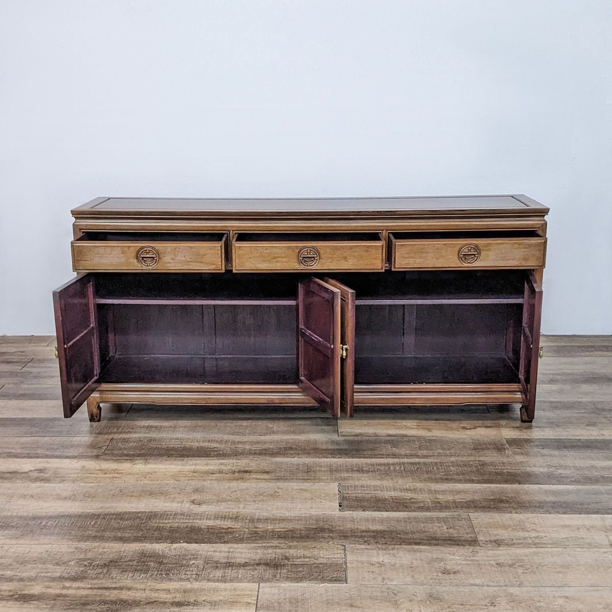 Reperch sideboard with Long Life design, showing open cupboards and drawers, displaying interior shelves.