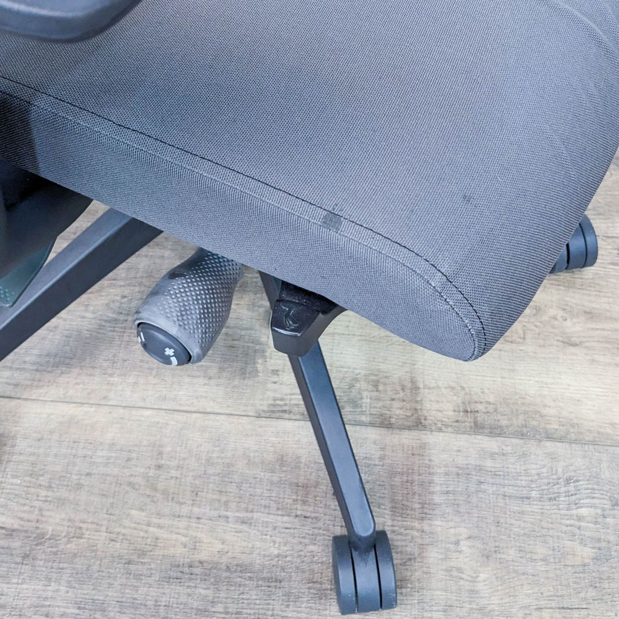 Close-up of a Torsa Engineering high-back office chair by SitOnIt, focusing on the mesh fabric seat and nylon base with casters.