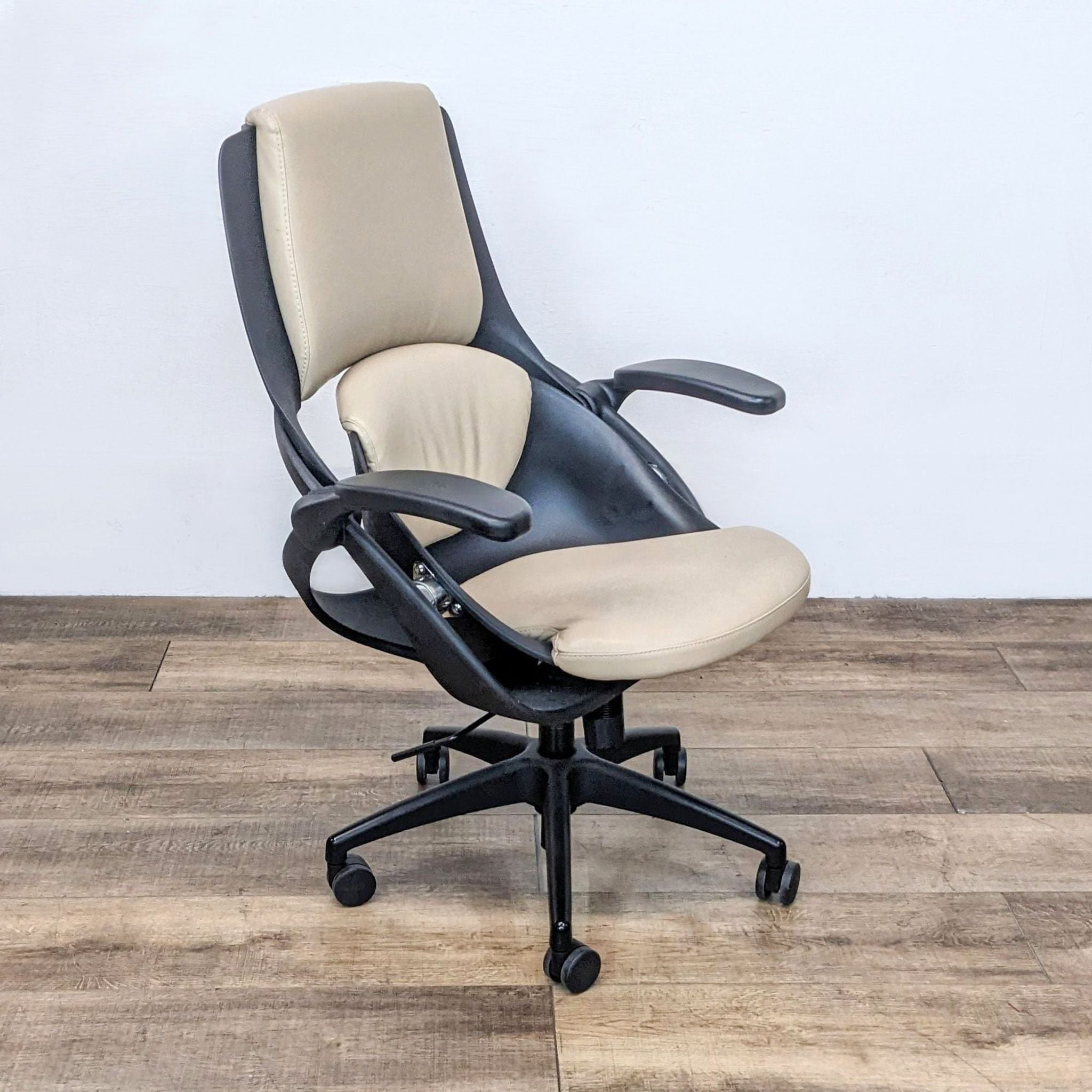 Ergonomic All33 Axion chair with aligned vertebrae support design, vegan leather, side view with slightly loose armrest.