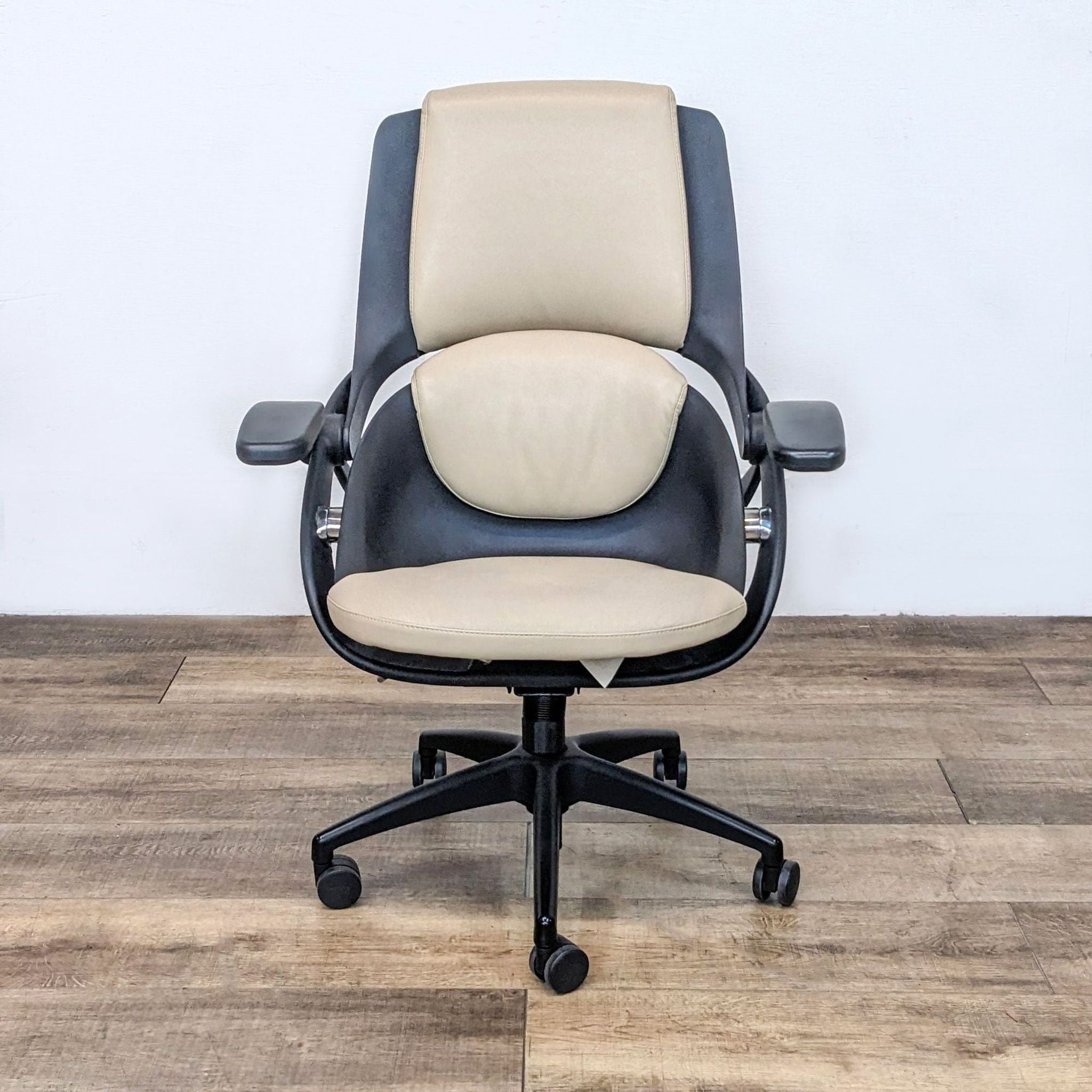 All33 Axion chair with lumbar support and Sit in Motion technology, vegan leather upholstery, loose arm visible.