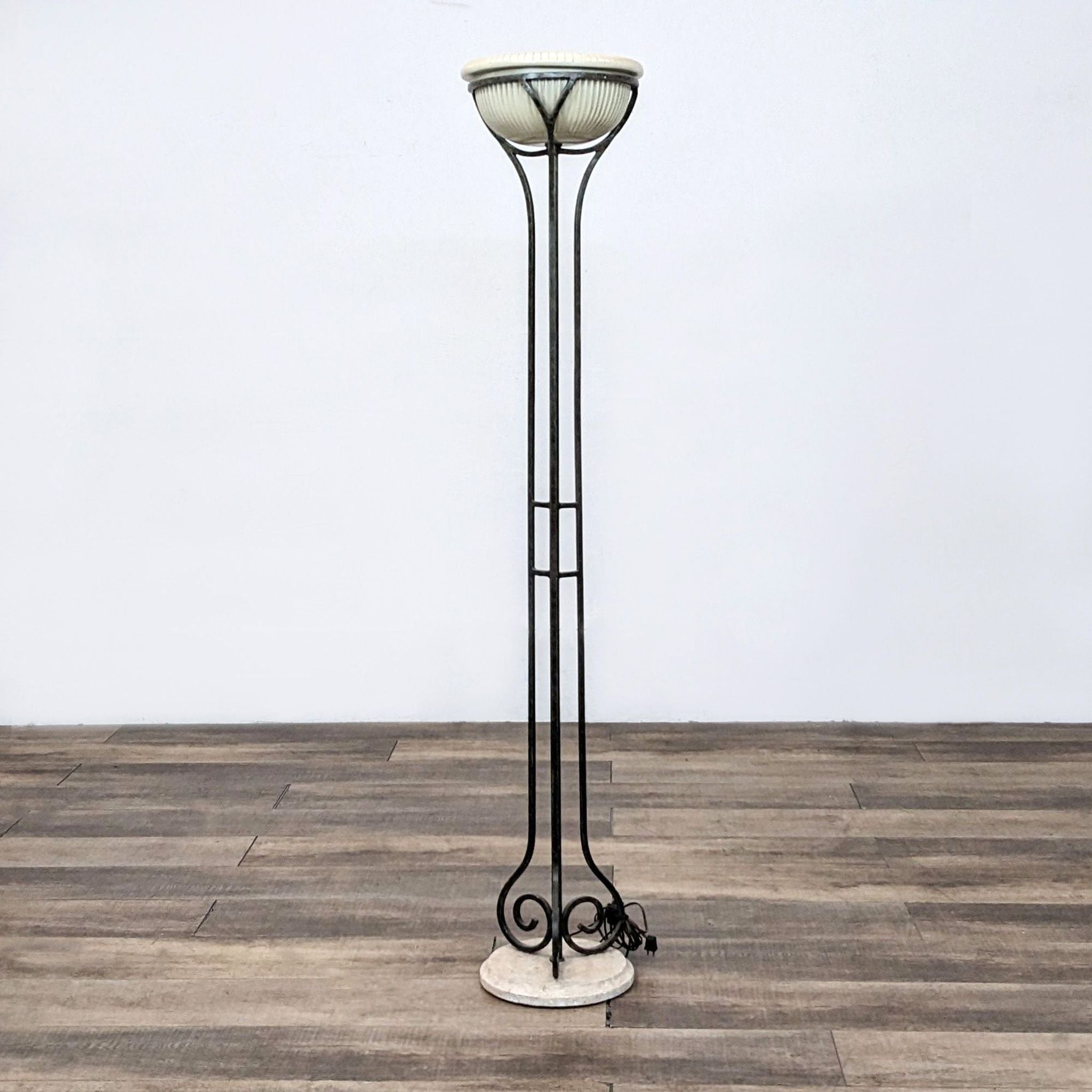 Alt text 1: Reperch brand floor lamp with intricate metalwork and frosted glass shade on a wooden floor.