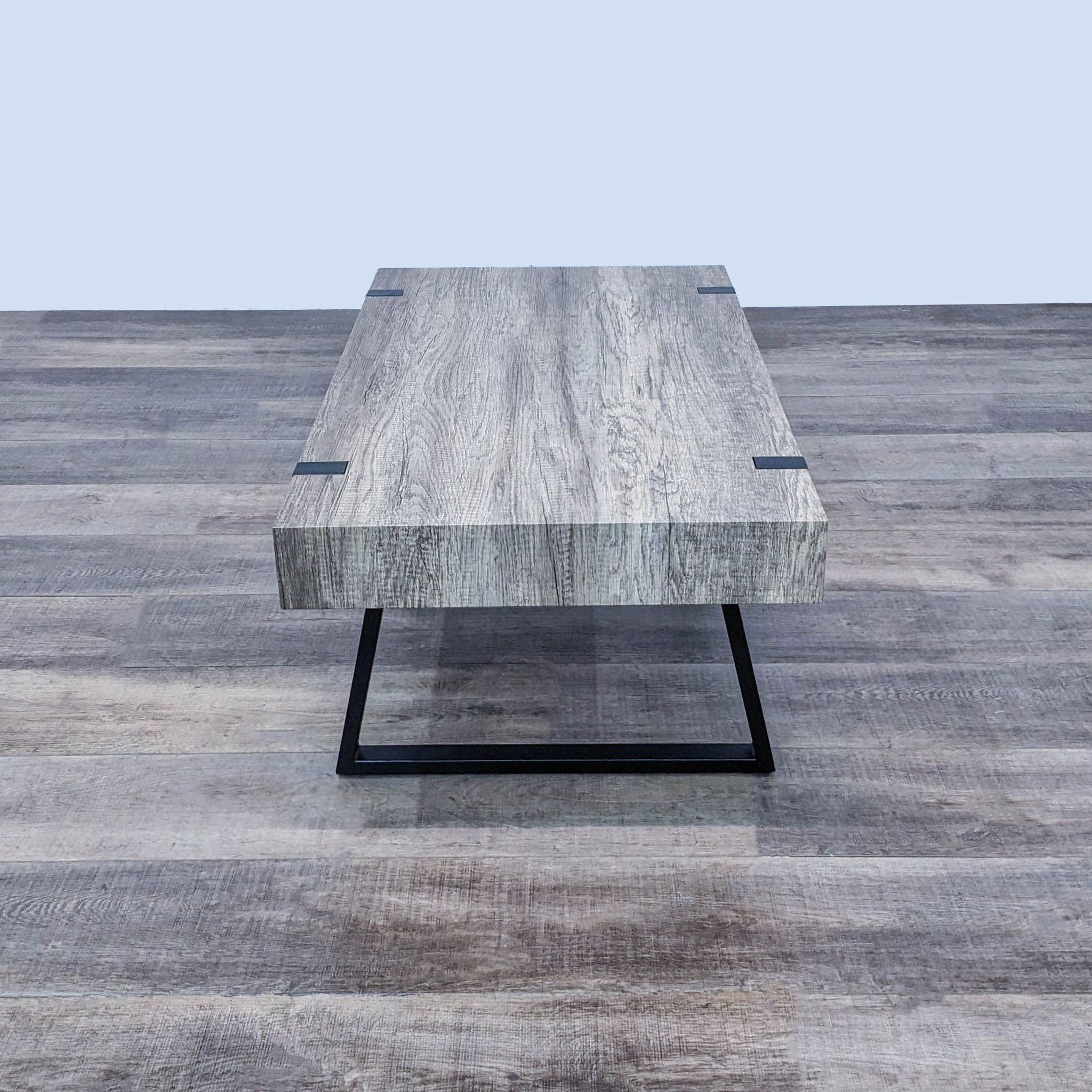 Modern rectangular Reperch coffee table showcasing wood texture and metallic frame, on a wooden floor.