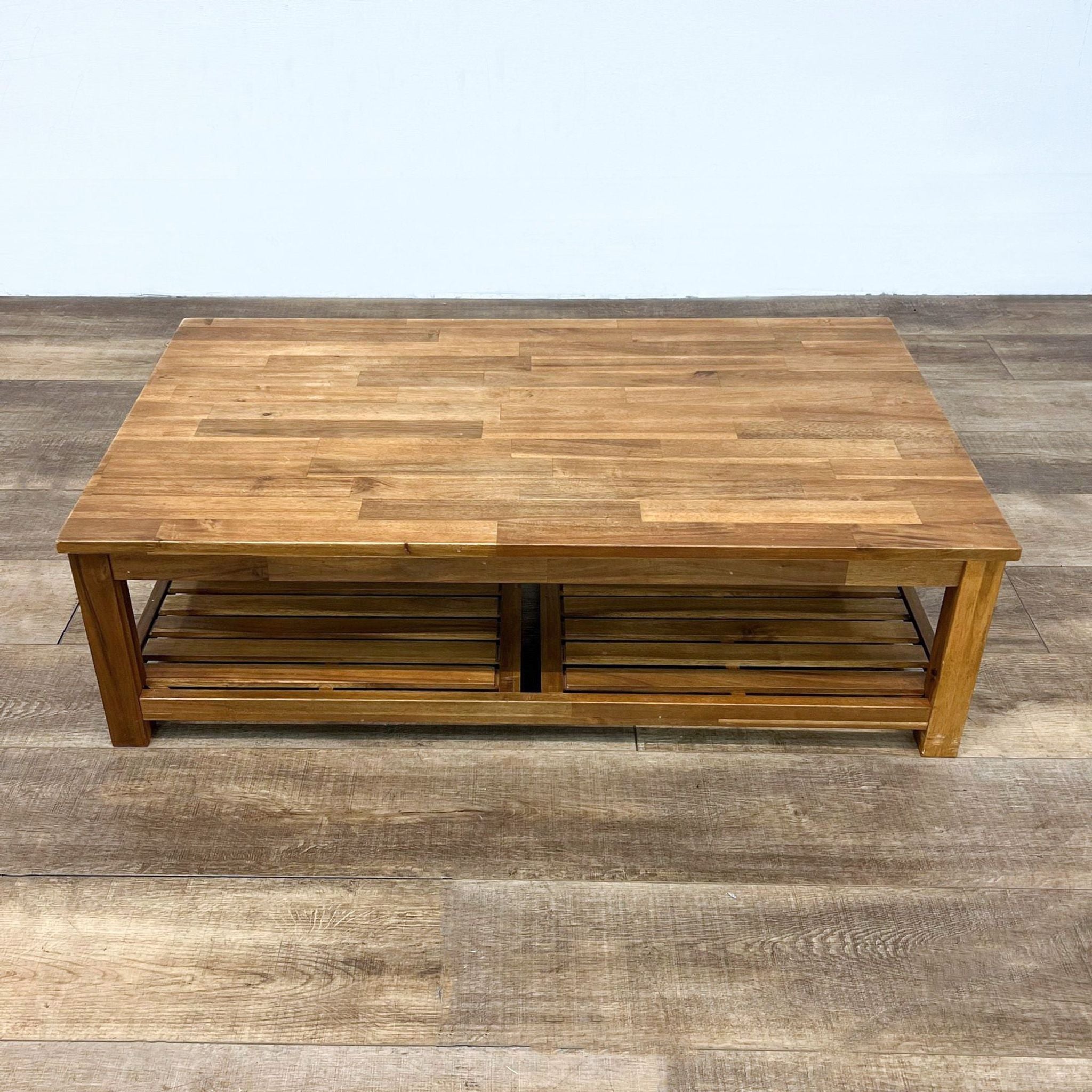 Reperch brand wooden coffee table with a parquet-style top and lower shelf, on a laminate floor.
