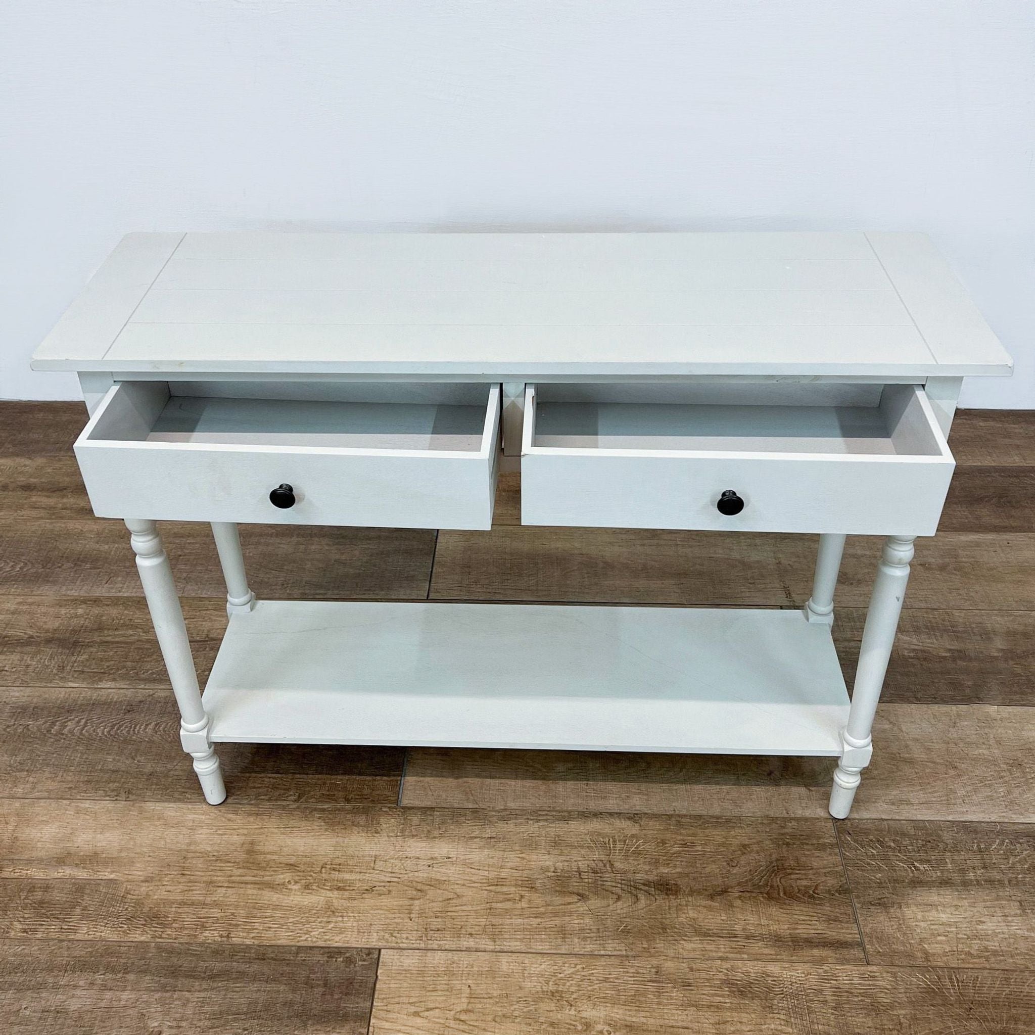 Alt text 2: Open-drawer view of a Reperch side table in light gray, revealing storage space, set on a wood-patterned floor.