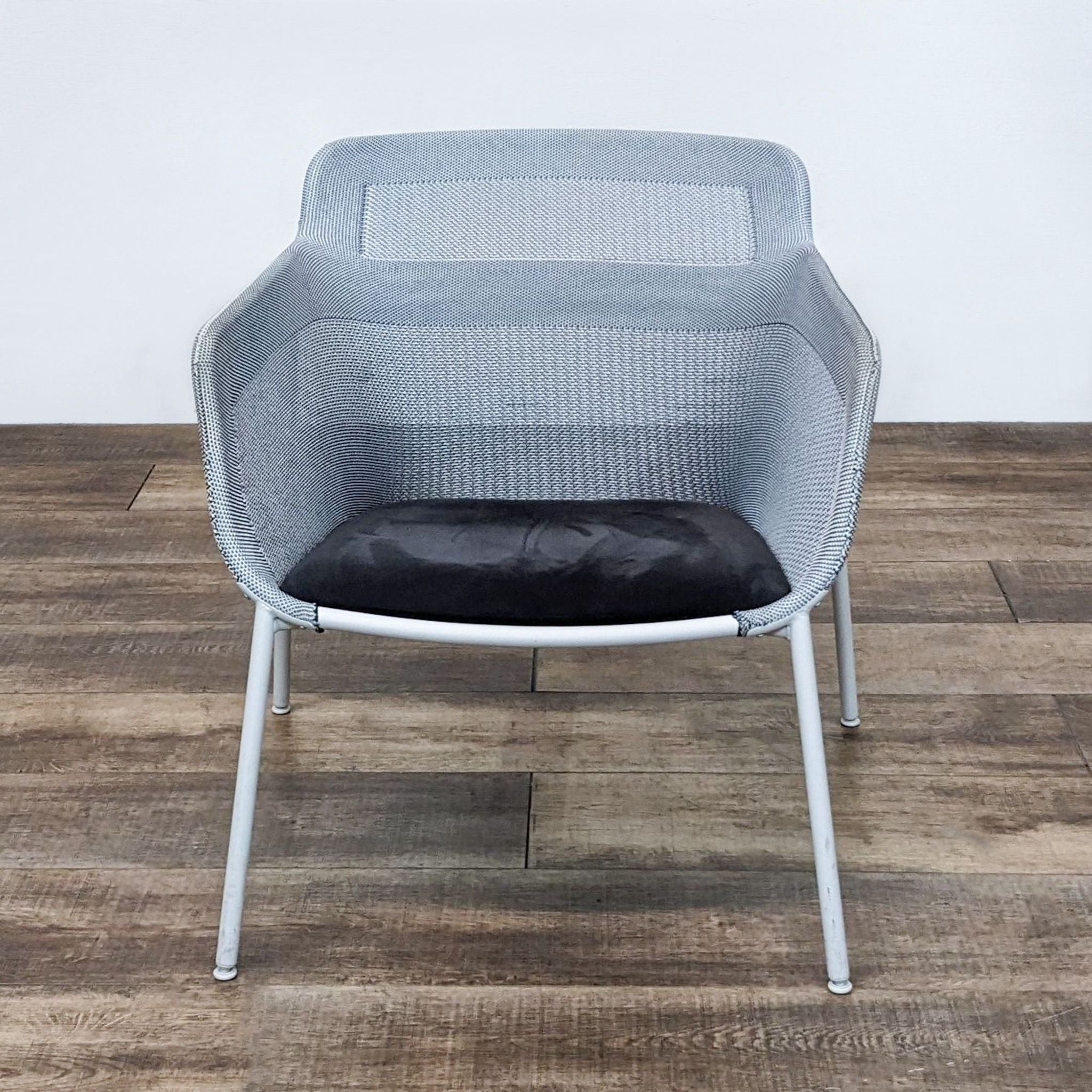 1. IKEA PS 2017 light grey 3D-knitted chair with a transparent feel, metal legs, and a dark cushion, suitable for small spaces.