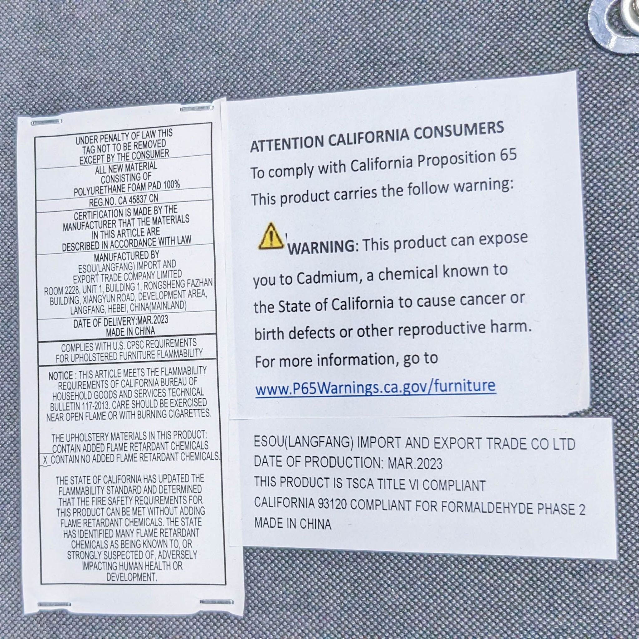 Close-up of a California Proposition 65 warning label on furniture indicating potential exposure to harmful chemicals.
