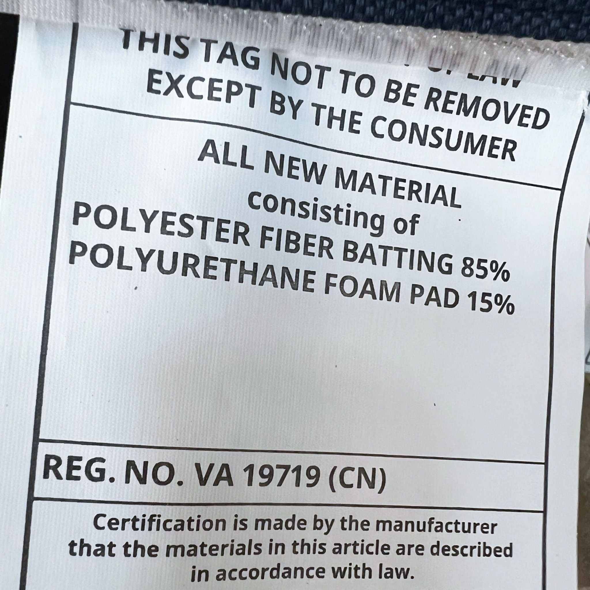 Material tag showing content details for an IKEA sectional, with 85% polyester fiber and 15% polyurethane foam.