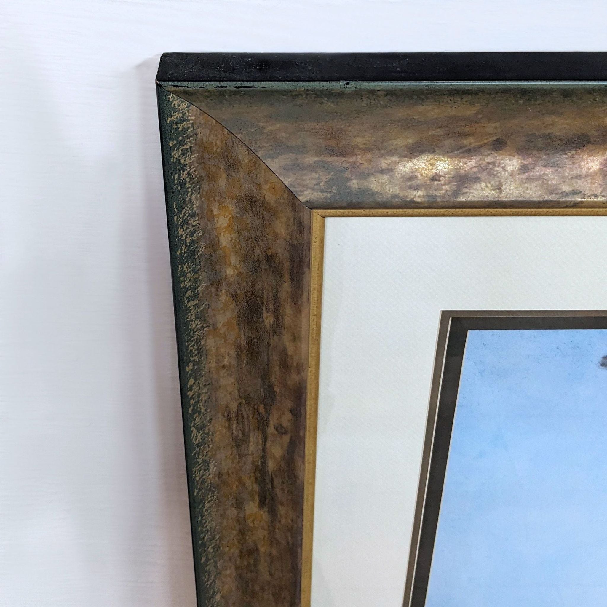 Close-up of a Reperch framed Giclee print's corner, highlighting the rustic texture and finish of the frame against the print.