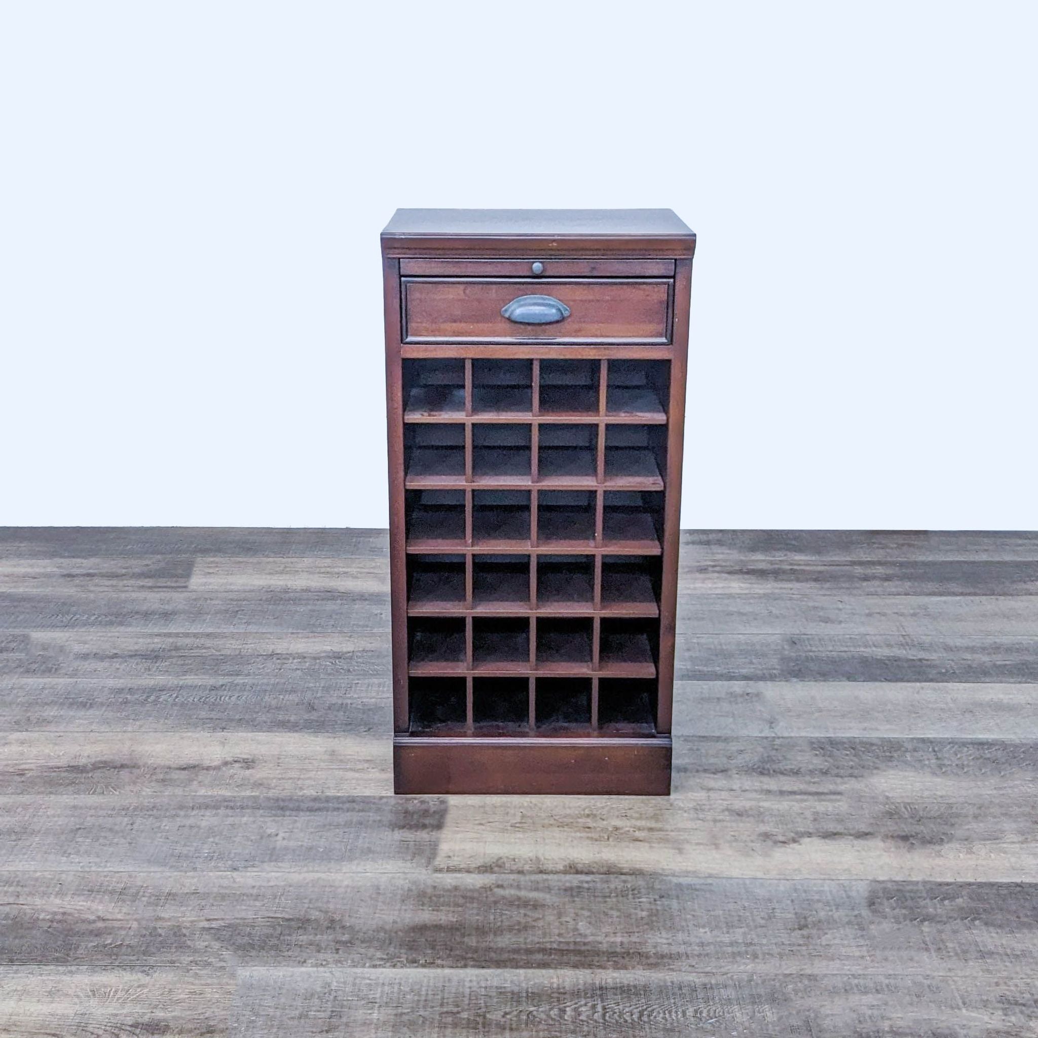 Pottery Barn wooden wine storage with 24 bottle capacity and a top drawer, placed on a wooden floor.