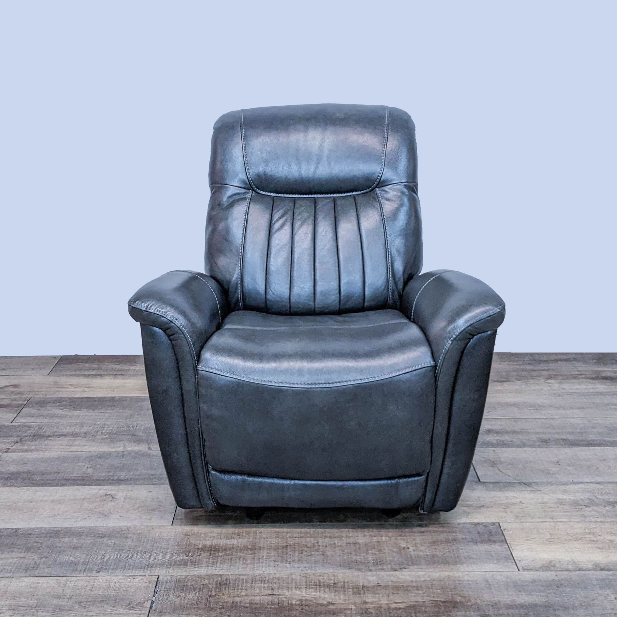 Home Meridian top grain leather power recliner with vertical back channeling and curved arms, USB port visible.