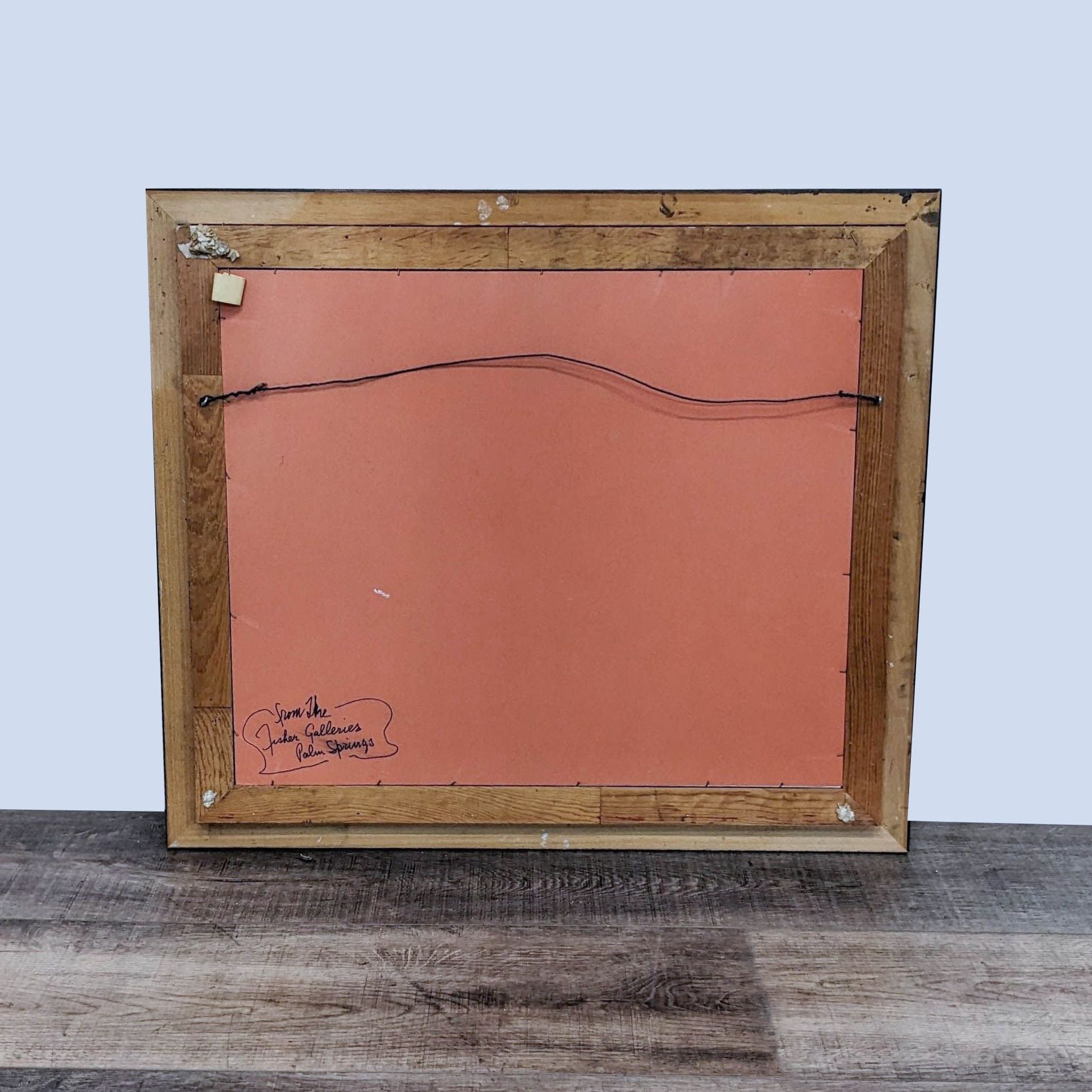 Rear view of a framed Reperch watercolor print showing the backboard with gallery label, wire, and wooden frame.
