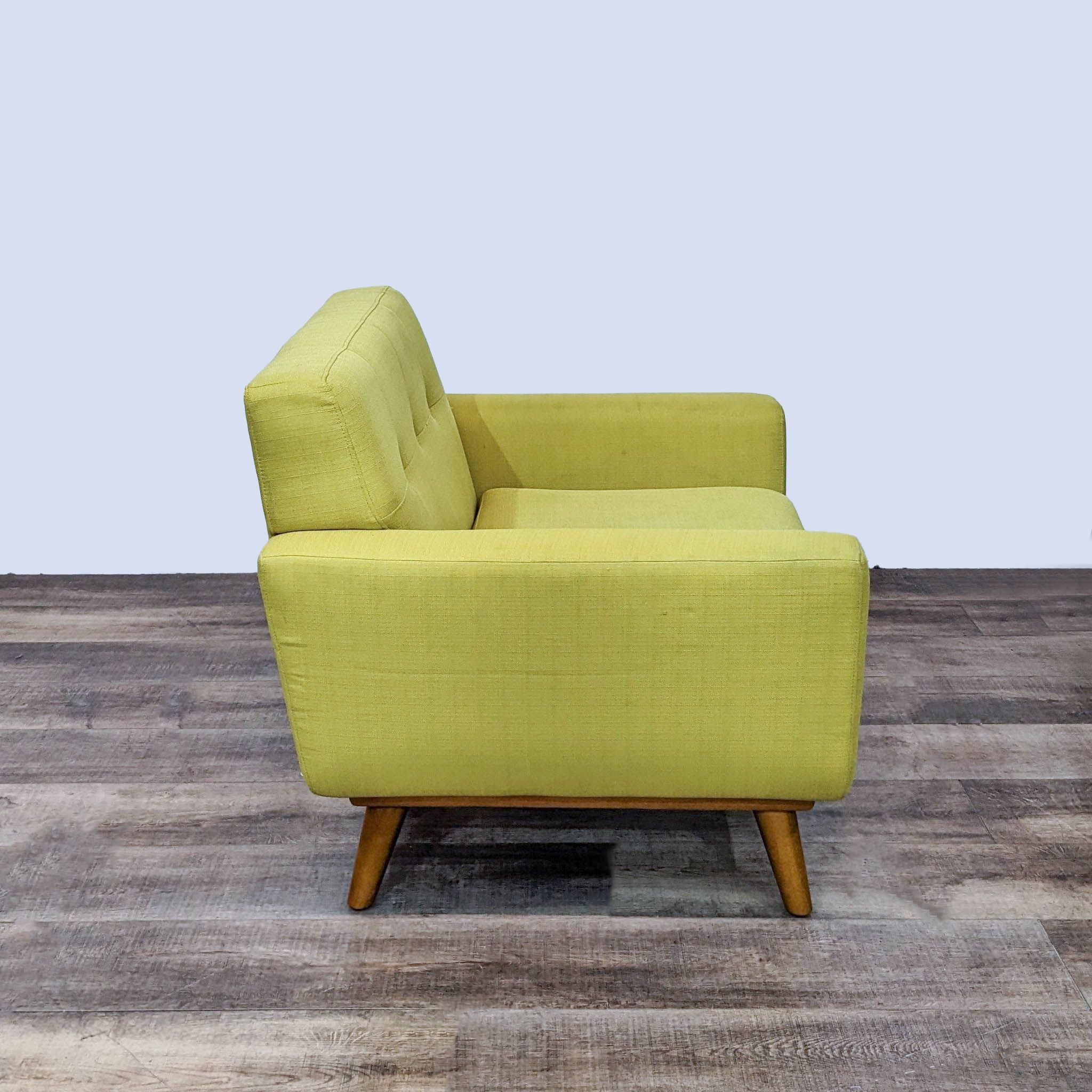 Mustard yellow Modway Engage armchair displaying button-tufted detailing and tapered wood legs, showcasing mid-century style.
