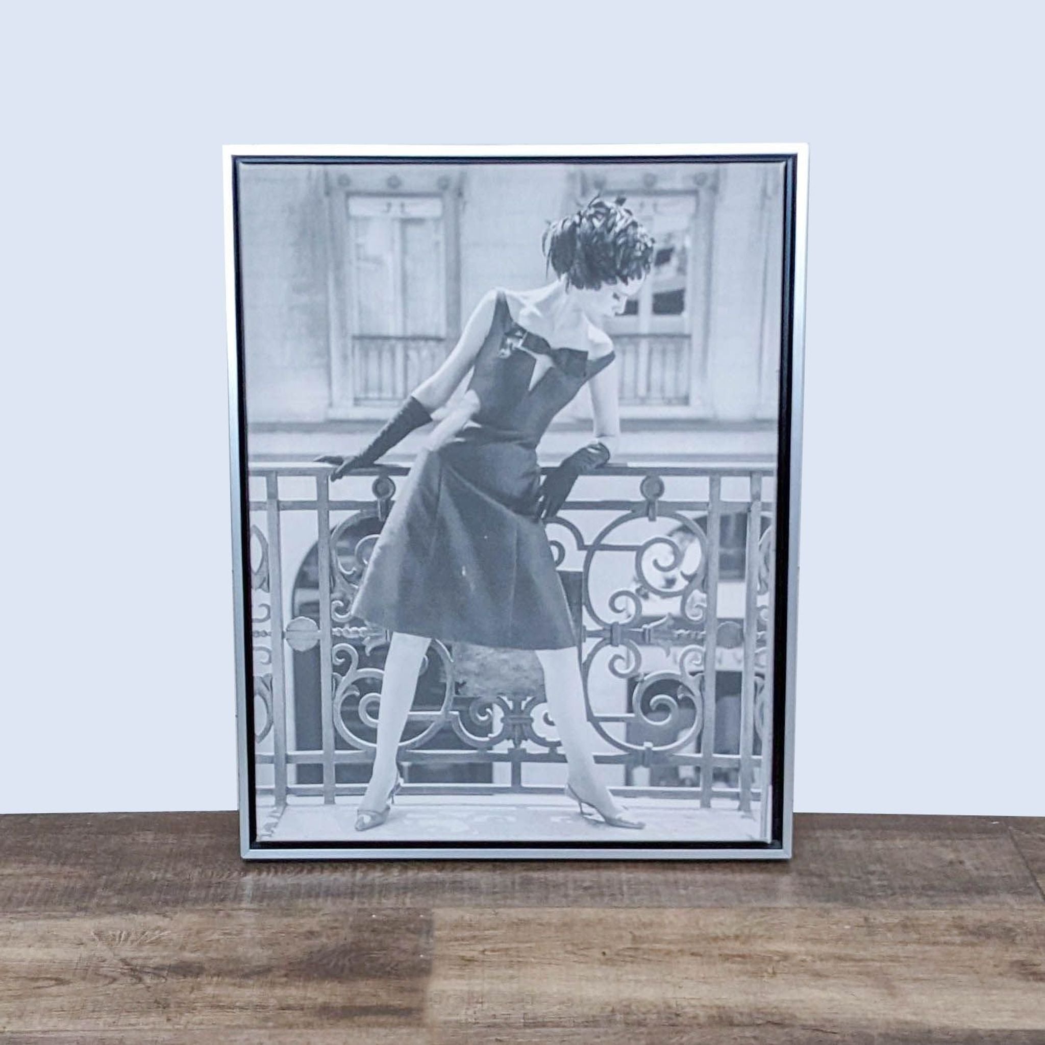 1. "Framed Reperch print of a woman in a 1960s evening gown and feathered hat, displayed on a wooden floor."