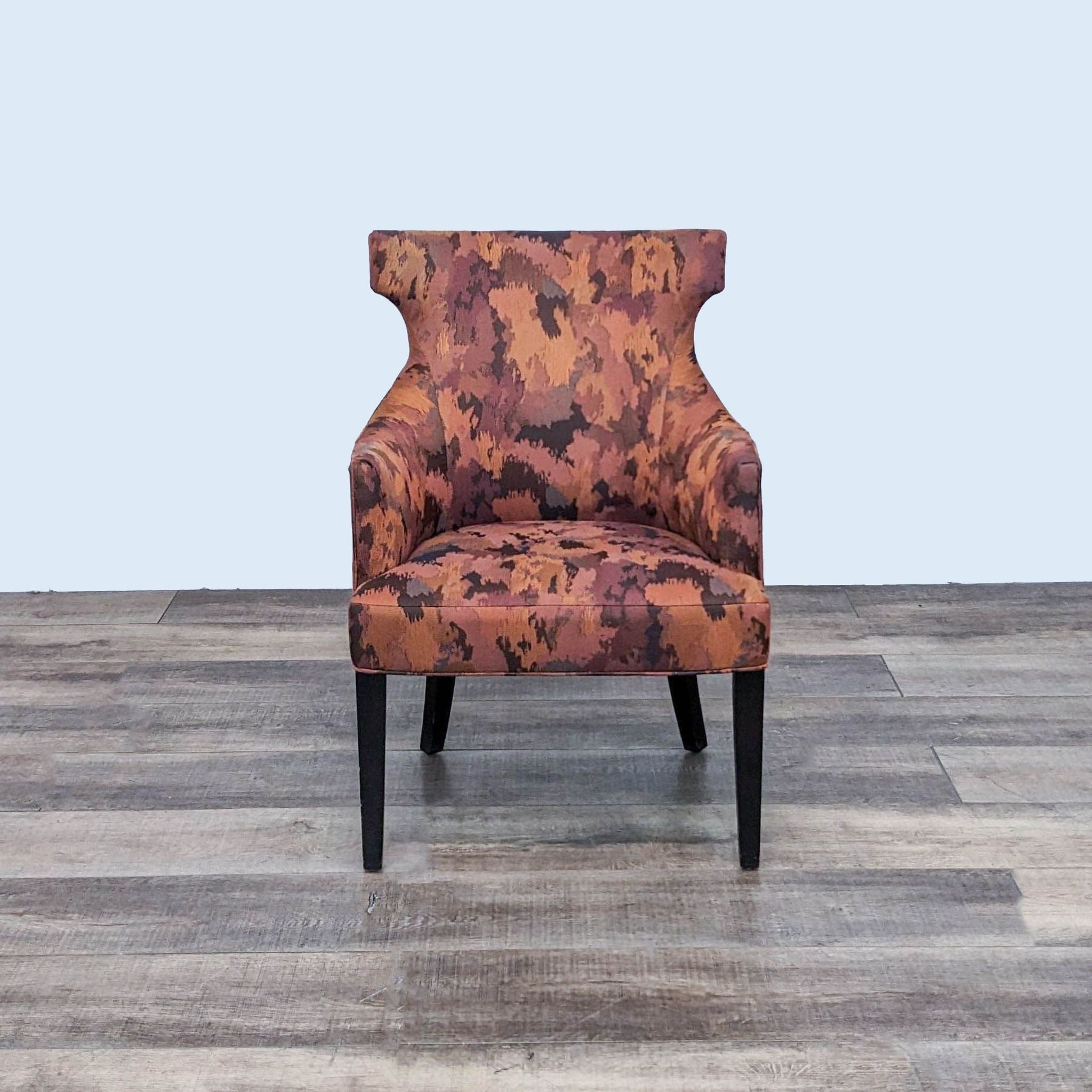 Reperch Alinea contemporary wingback chair with abstract pattern on wooden floor, front view.