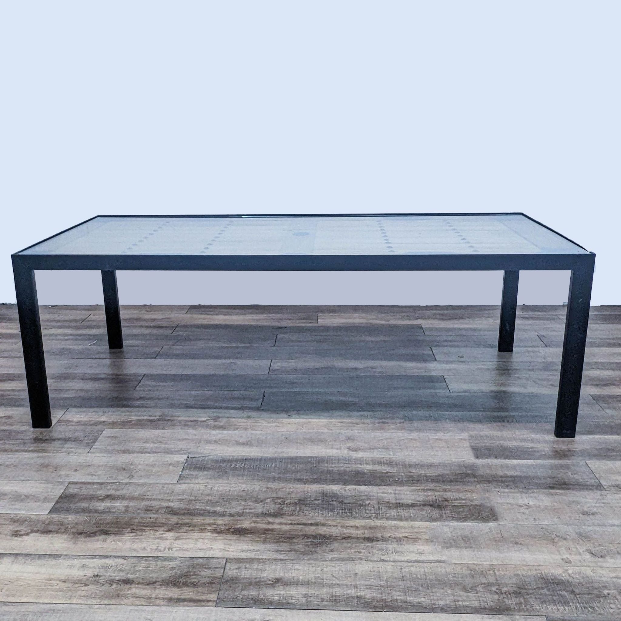 Tansu Design Parsons style dining table with metal base and tempered glass showcasing Japanese warehouse door.