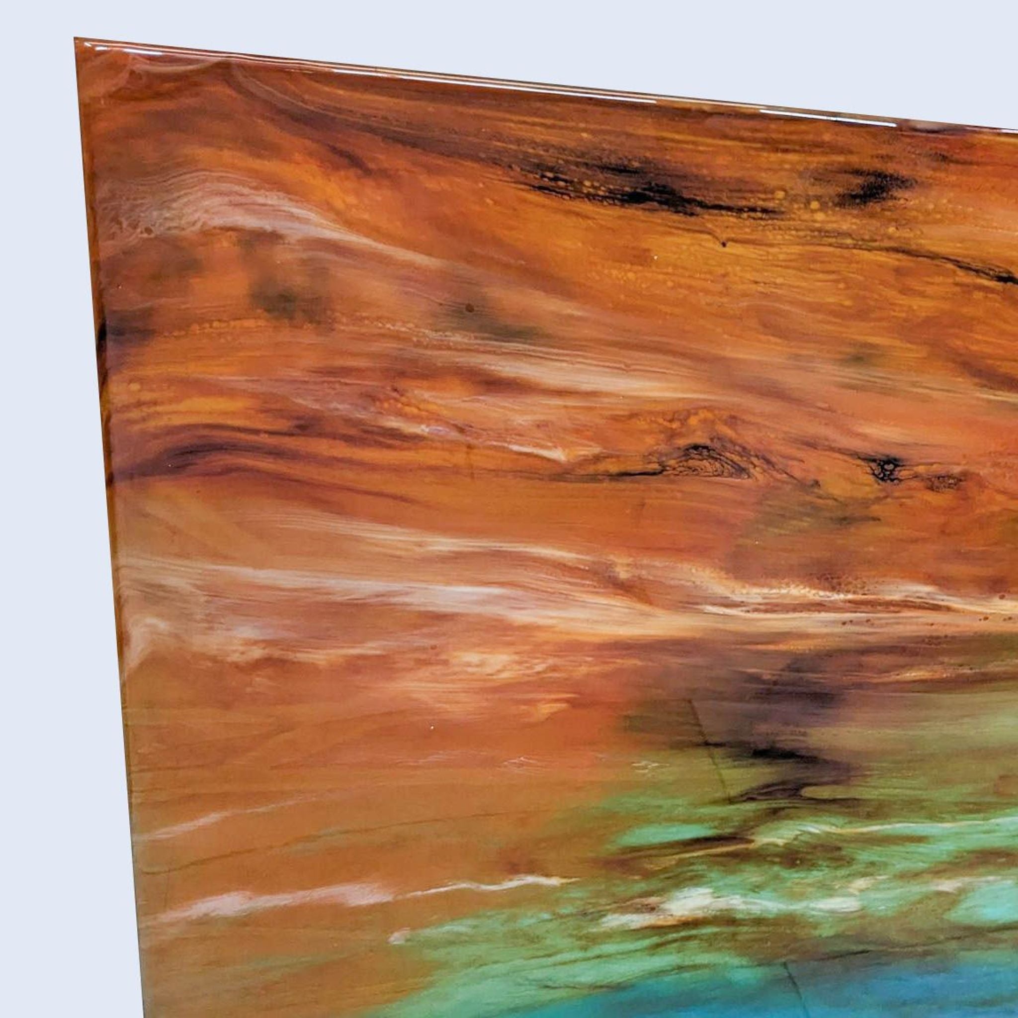 Colorful abstract painting by Christo Braun with a blurred transition from ocean blue to earthy orange tones, mounted vertically.