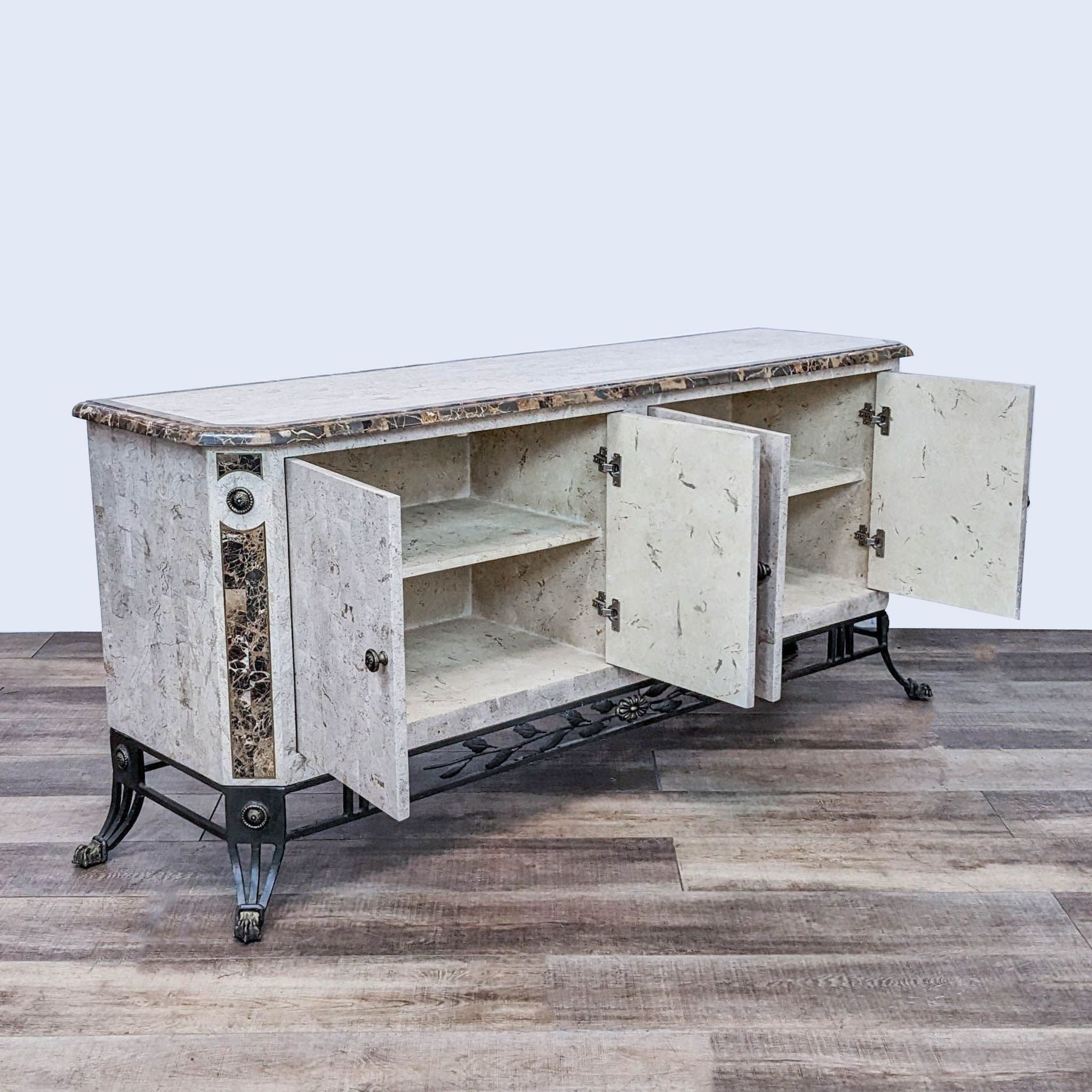 Alt text 2: Open-door view of a Reperch marble-veneered credenza revealing faux-finished shelves, with brass and iron detailing.