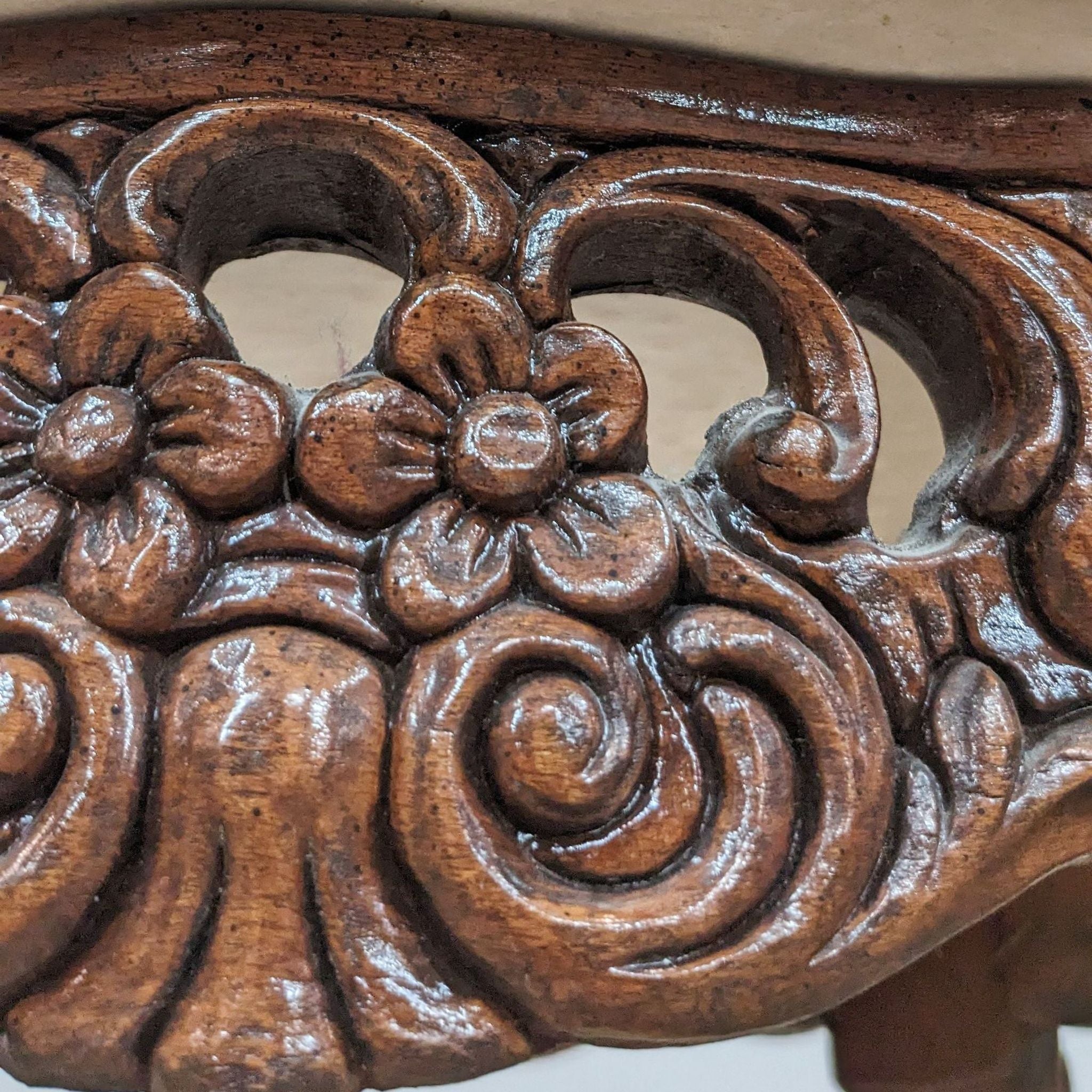 Image 2: Close-up of Reperch end table's wood carving, showcasing intricate floral patterns.