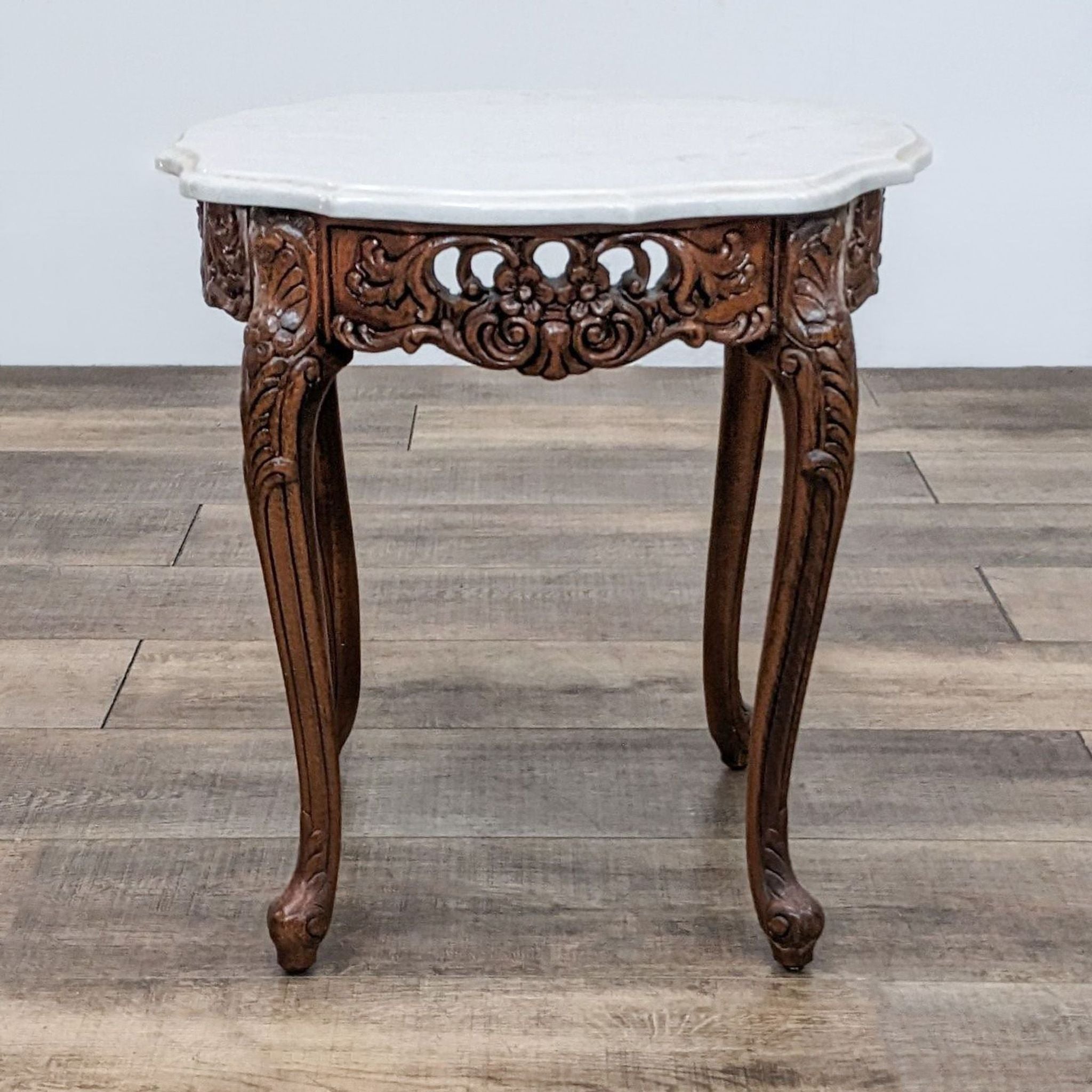 Image 1: Reperch end table with a scalloped marble top and detailed wooden cabriole legs.