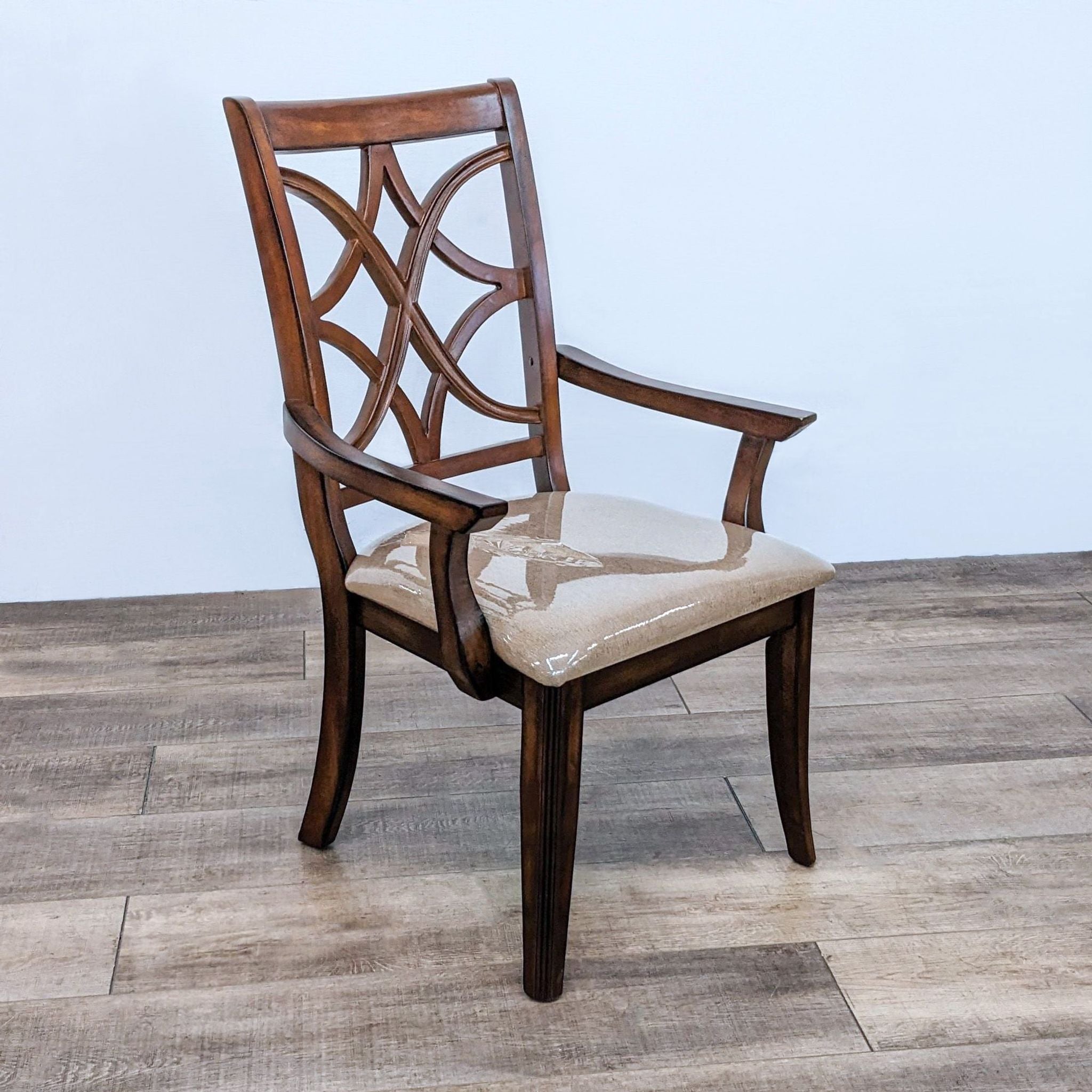 Macy's contemporary dining armchair with lattice back and cushioned seat on a wooden floor.