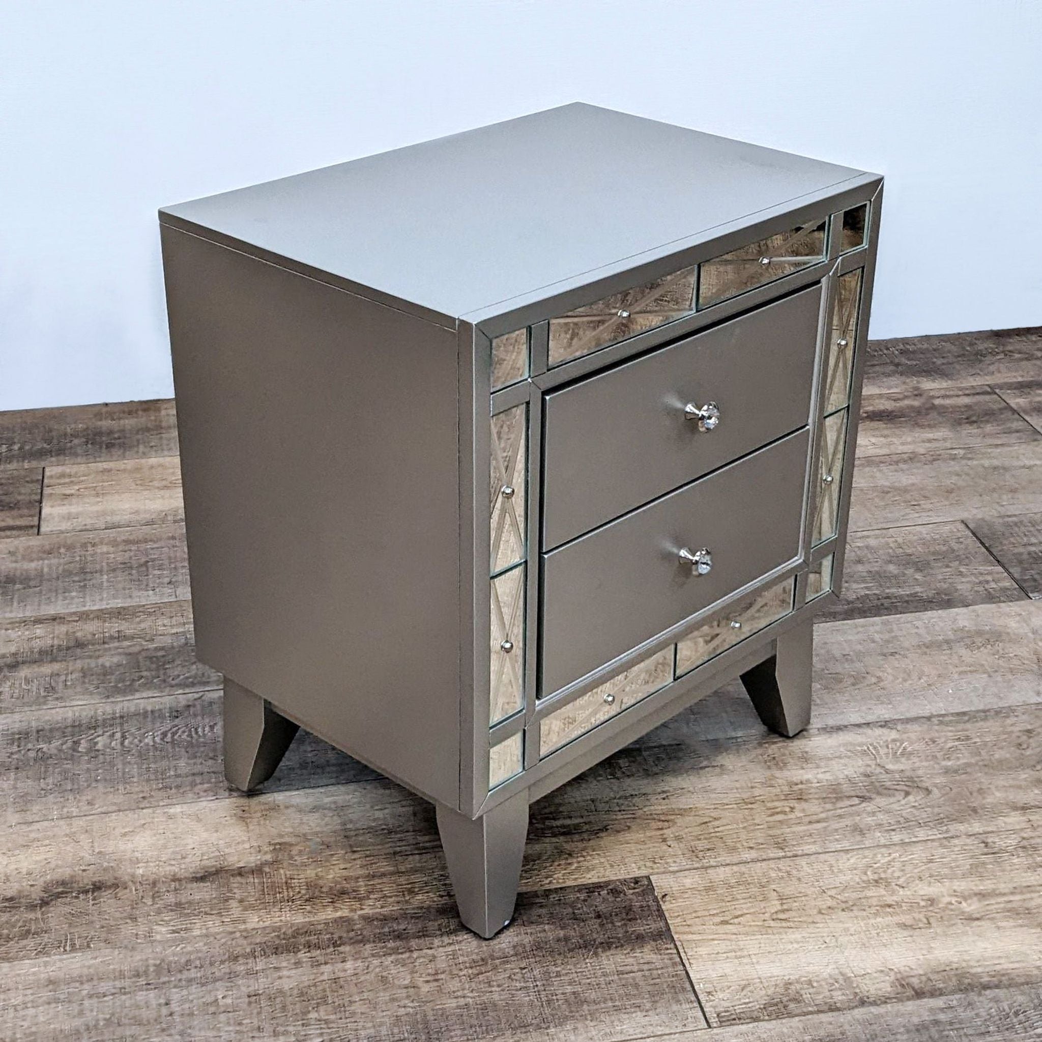 Transitional two-drawer Coaster Fine Furniture end table with retro angled legs and etched mirror panels, finished in metallic mercury.
