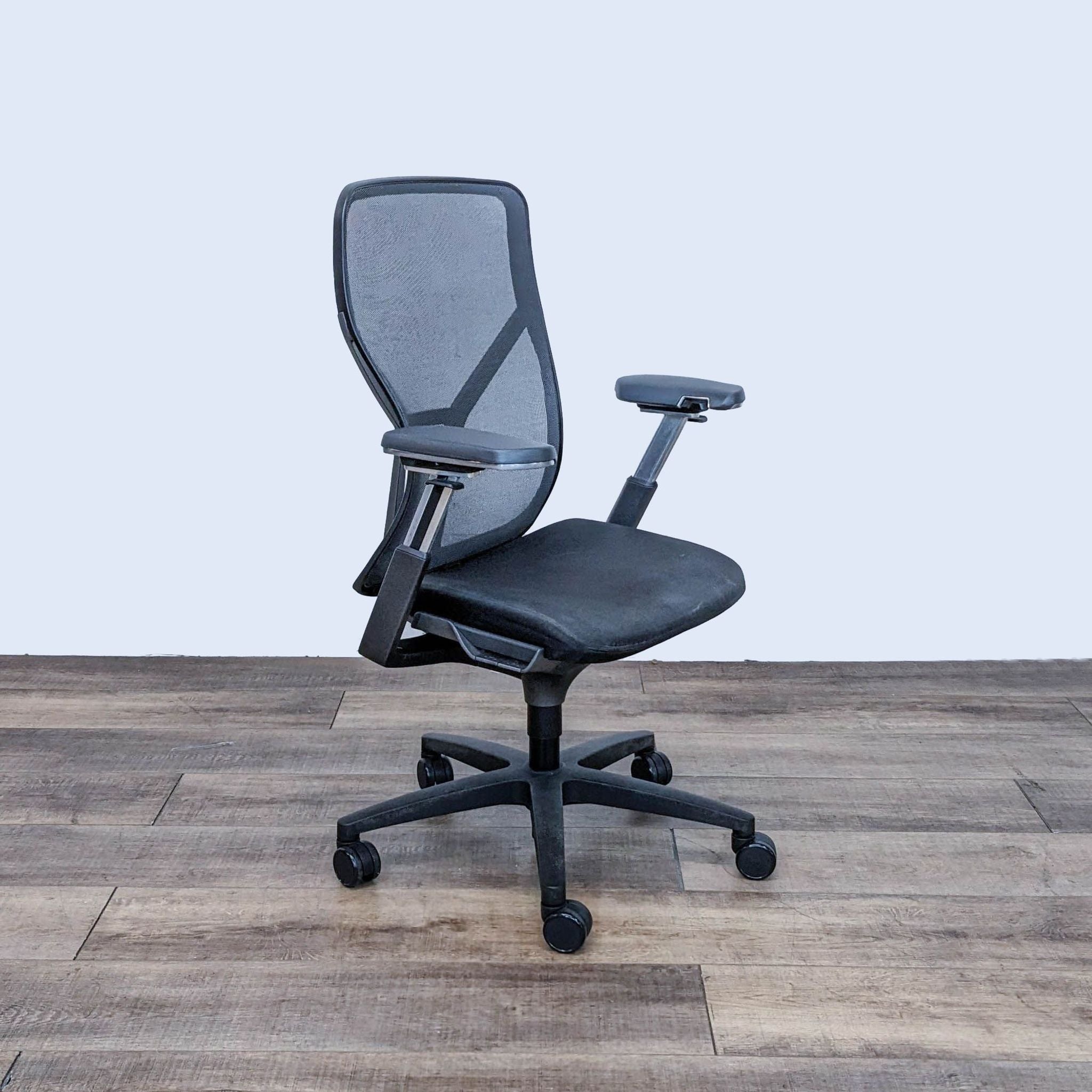 AllSteel Acuity ergonomic office chair with mesh backrest and adjustable armrests on caster wheels.