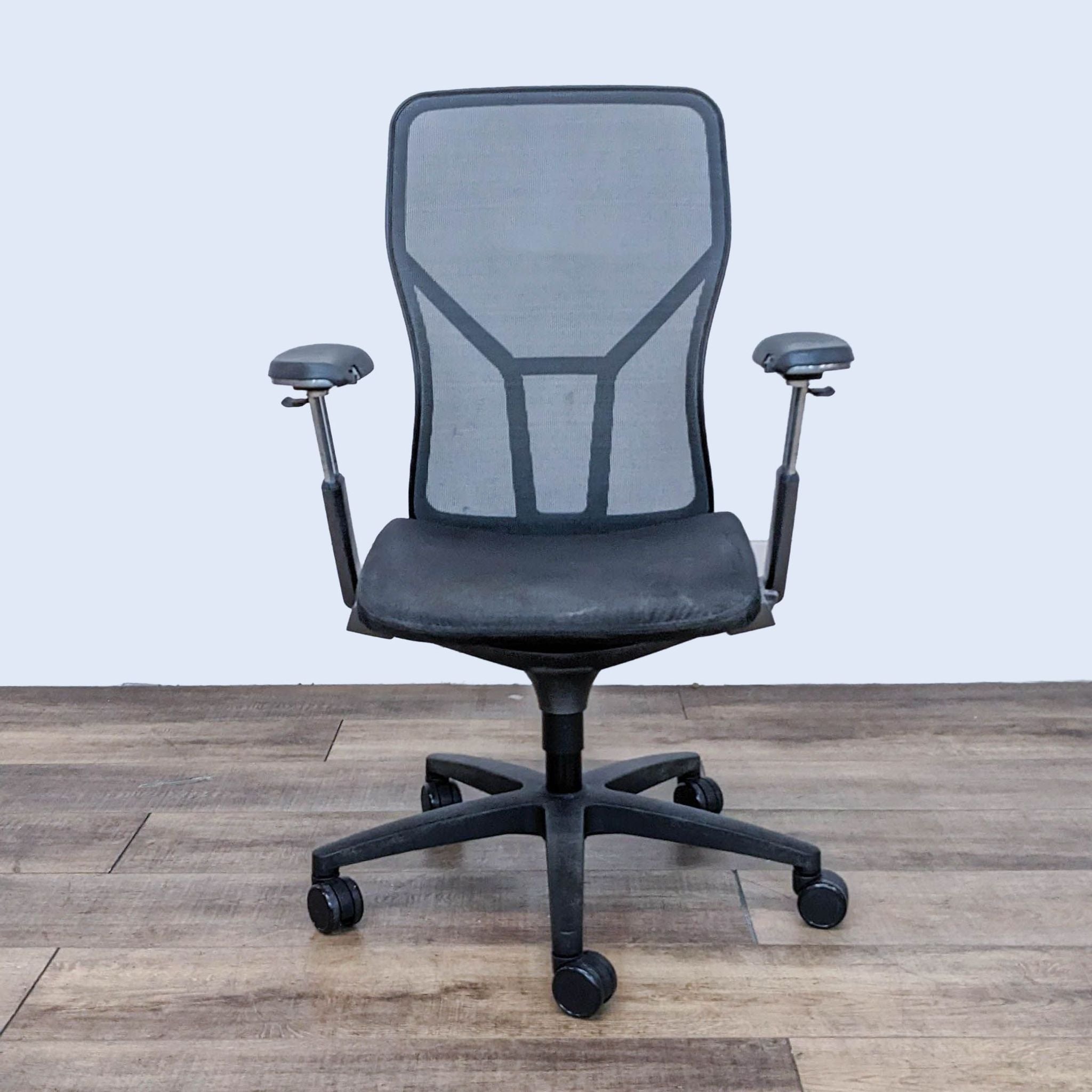 AllSteel Acuity ergonomic office chair with mesh backrest and adjustable armrests, on casters.