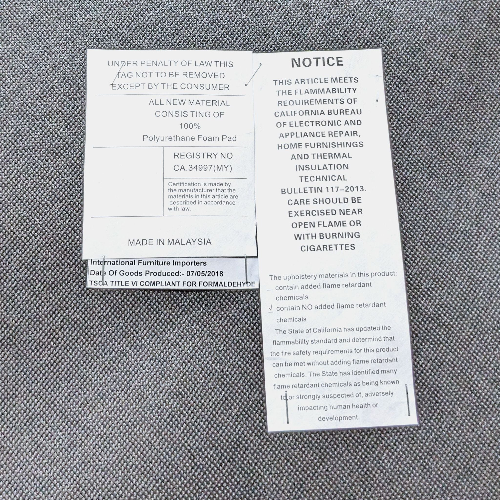 Label on a Reperch dining chair detailing material composition and compliance with safety standards.