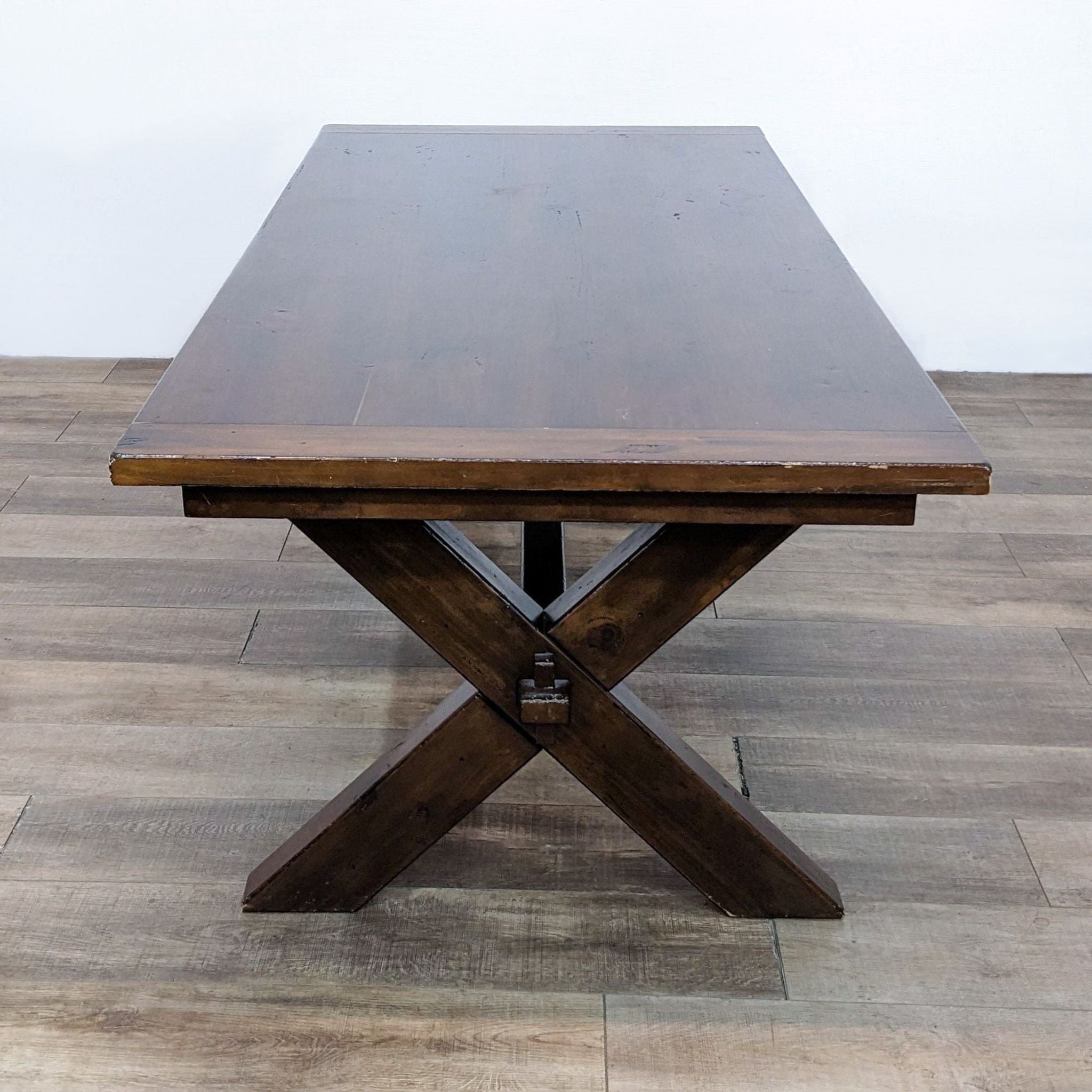 Front view of Tuscano dining table by Pottery Barn, showing its keyed-through tenons and extendable top.