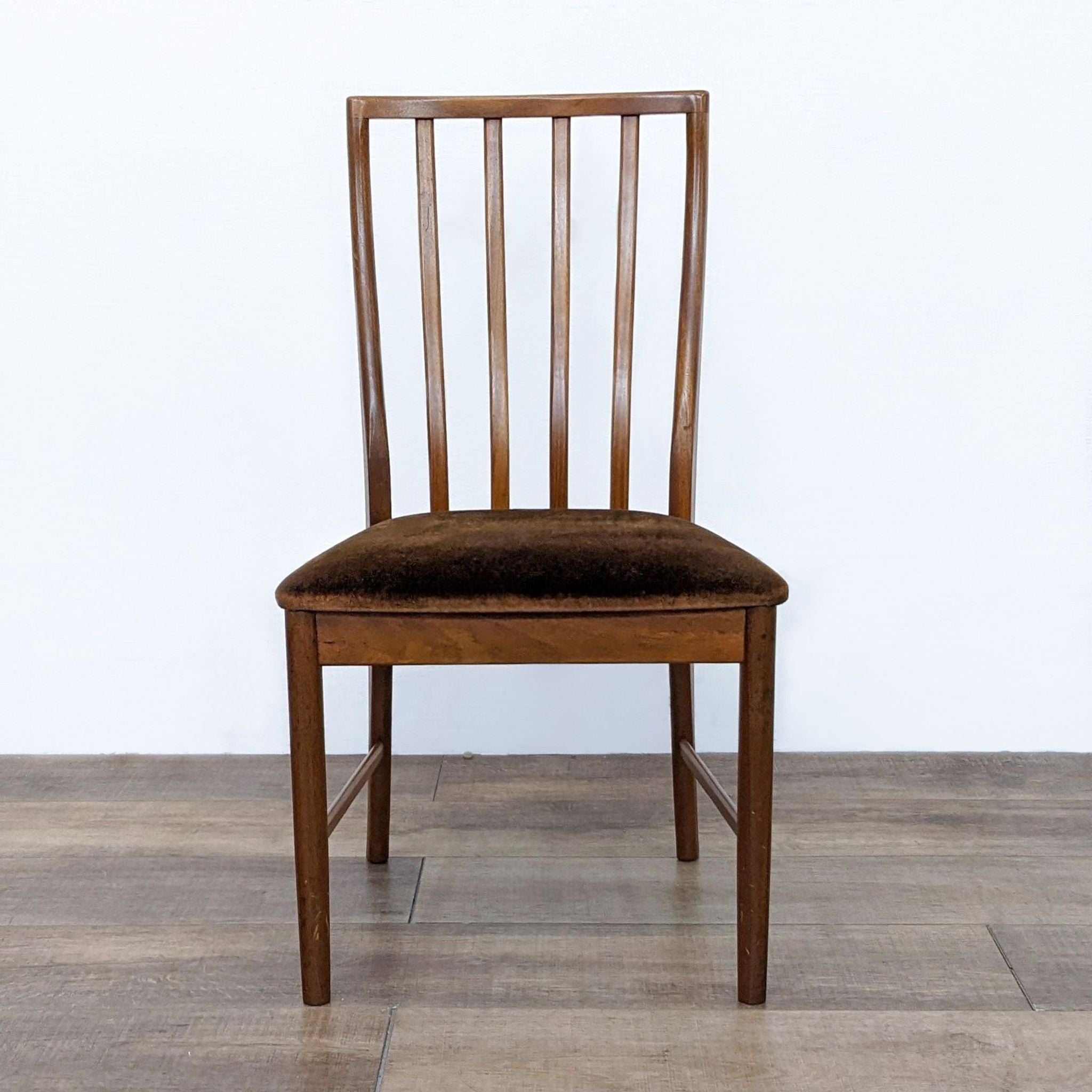 Reperch transitional dining chair with wooden slat back and brown velvet upholstered seat viewed from the front.