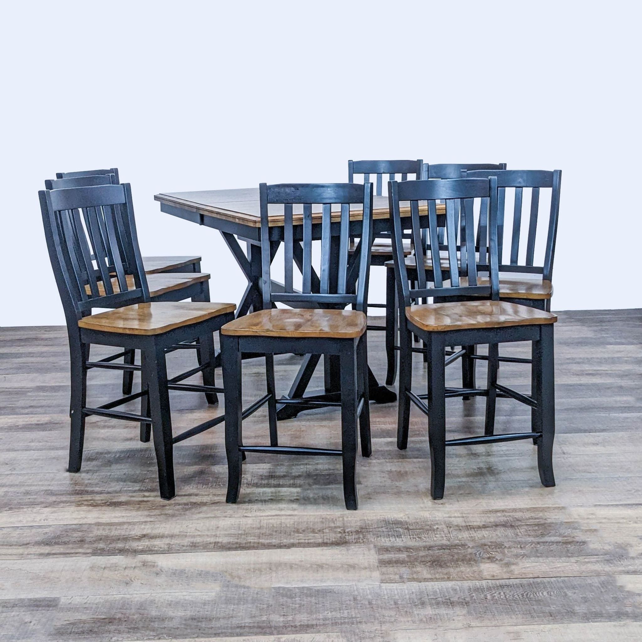 Alt text 1: Winners Only 7-piece dining set with a rectangular wood table and six chairs with black bases on a wooden floor.