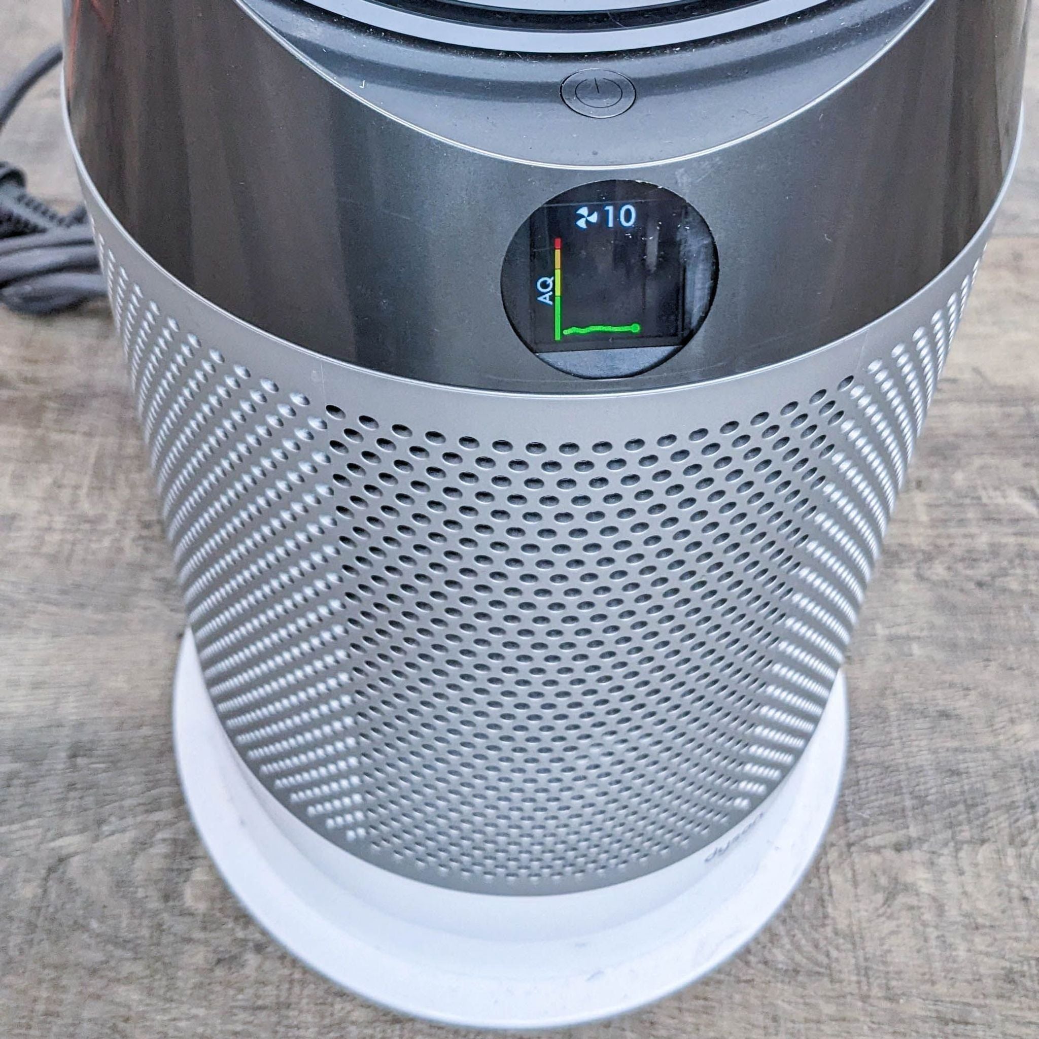 Close-up of Dyson air purifier's digital display, showing filter life and air quality indicators.