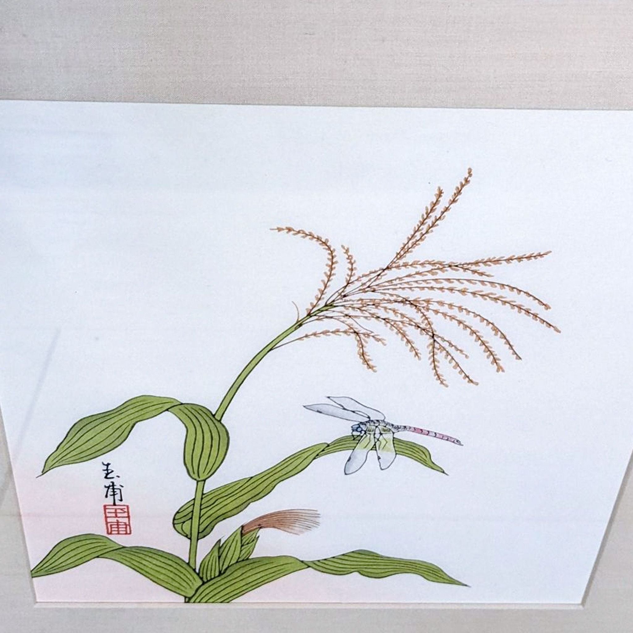 Tranquil botanical artwork with feathery plant details and an intricate dragonfly, adorned with Asian script, from Reperch brand.