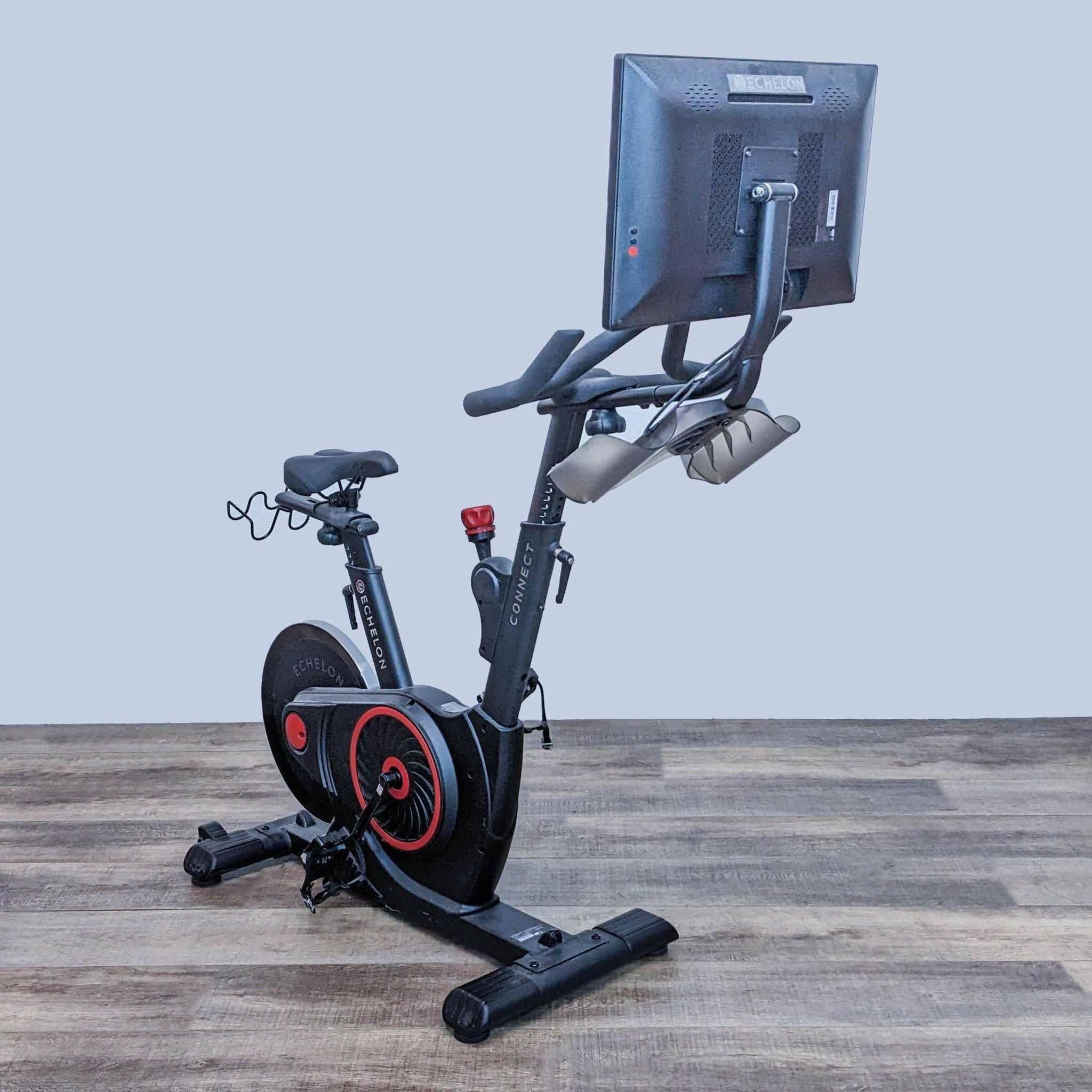 Echelon EX-5s Smart Connect Fitness Bike with a large rotating HD screen and ergonomic design, set against a neutral background.