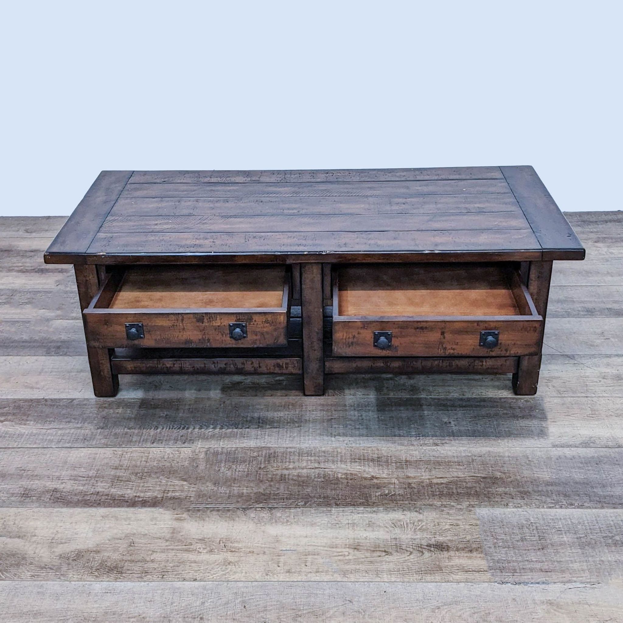 Reperch Coffee Table view with open drawers revealing storage, showcasing metal hardware.