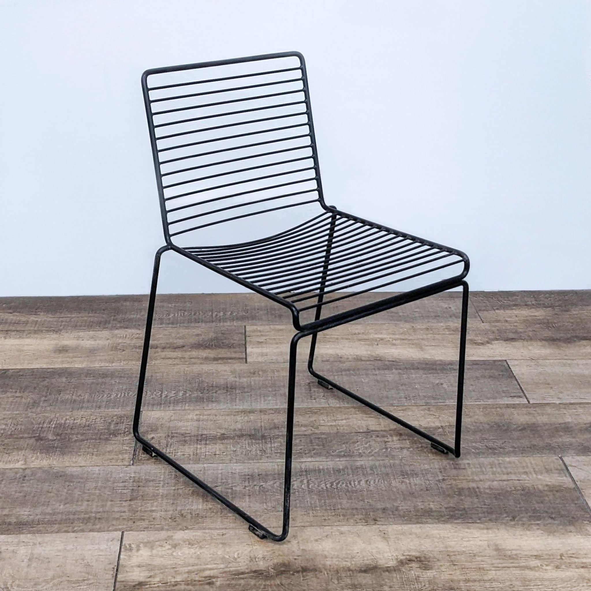 Steel HAY Hee modern dining chair with powder-coated finish, suitable for both indoor and outdoor, stackable design.